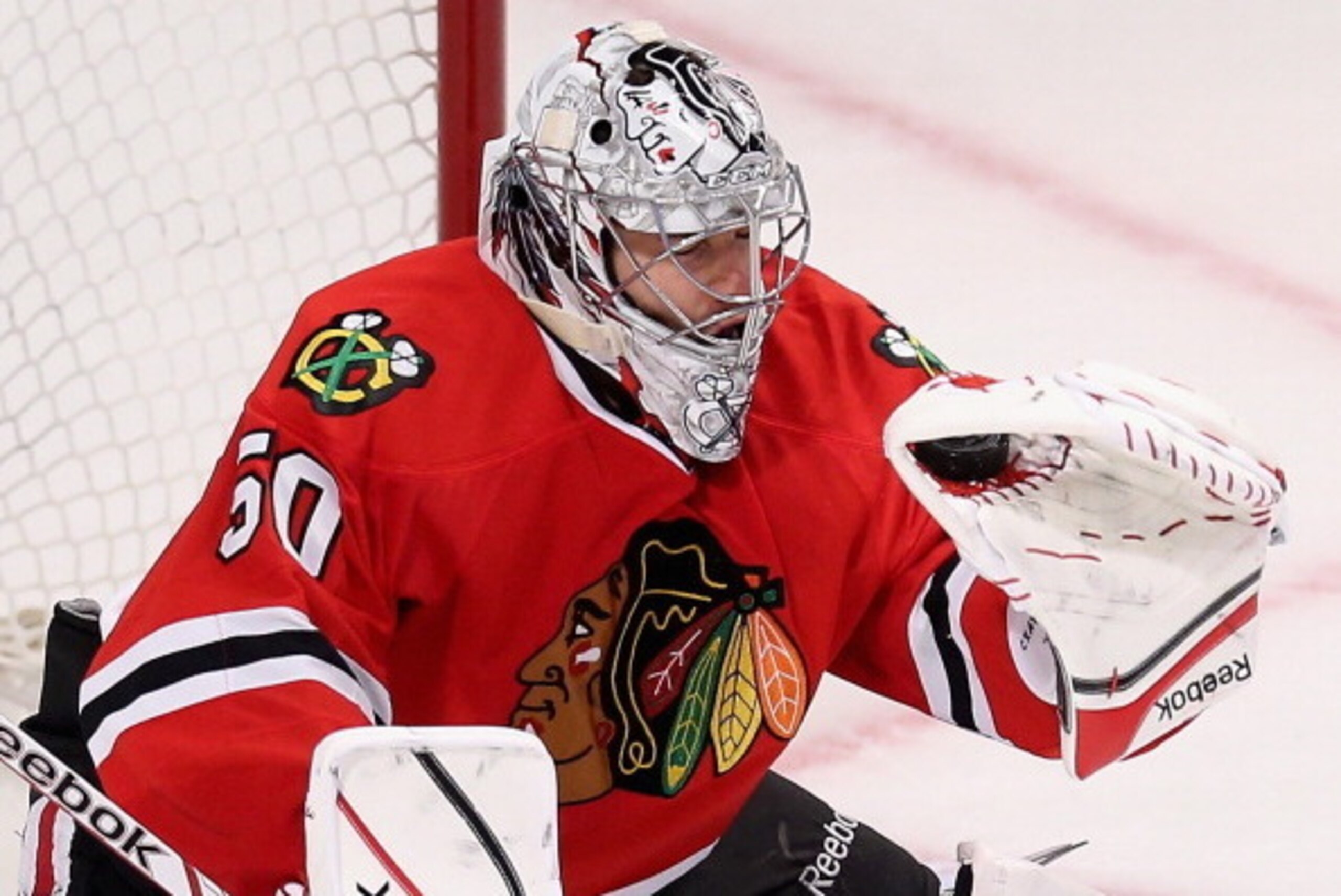 CHICAGO, IL - MARCH 14: Corey Crawford #50 of the Chicago Blackhawks makes a glove save against the Nashville Predators at the United Center on March 14, 2014  in Chicago, Illinois. The Predators defeated the Blackhawks 3-2. (Photo by Jonathan Daniel/Gett