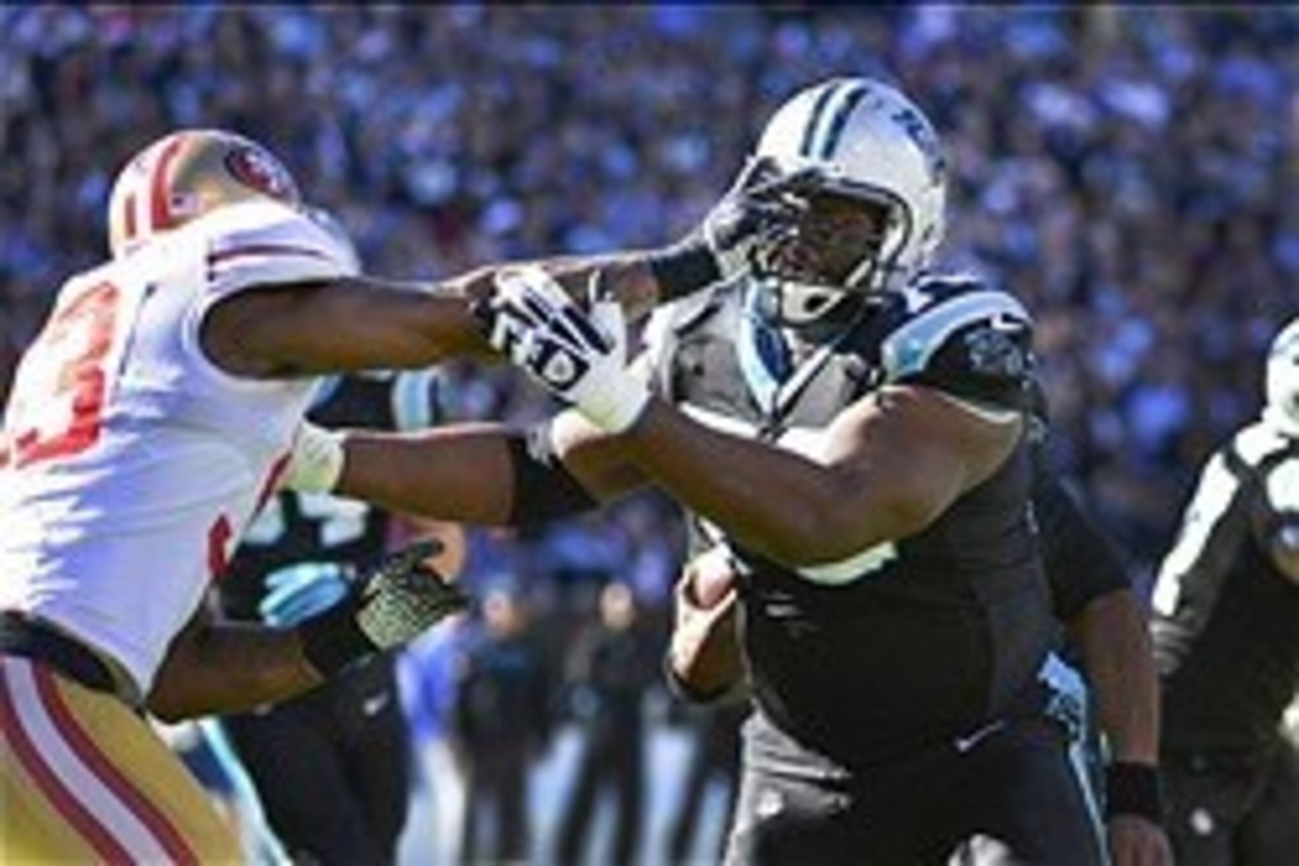 Jan 12, 2014; Charlotte, NC, USA; Carolina Panthers guard Travelle Wharton (70) blocks as San Francisco 49ers inside linebacker NaVorro Bowman (53) defends during the second quarter of the 2013 NFC divisional playoff football game at Bank of America Stadi