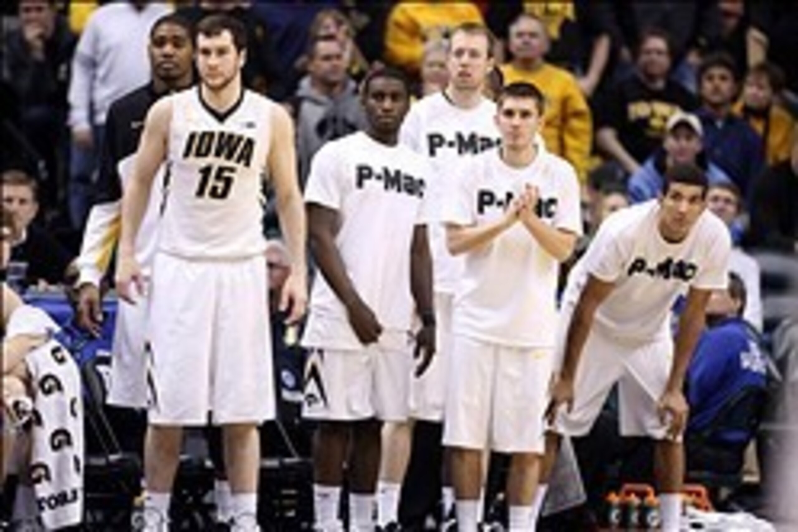 Mar 13, 2014; Indianapolis, IN, USA; Iowa Hawkeyes bench wear t-shirts that say P-MAC in support of coach Fran McCaffery's son Patrick who has a cancerous thyroid tumor. The shirts were worn in the game against the Northwestern Wildcats in the first round Mar 13, 2014; Indianapolis, IN, USA; Iowa Hawkeyes bench wear t-shirts that say P-MAC in support of coach Fran McCaffery's son Patrick who has a cancerous thyroid tumor. The shirts were worn in the game against the Northwestern Wildcats in the first round