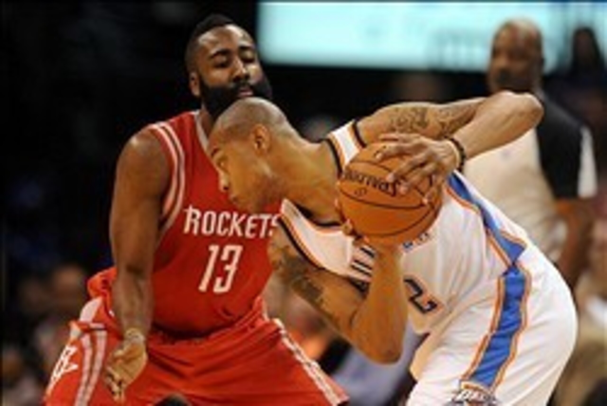 Mar 11, 2014; Oklahoma City, OK, USA;  Oklahoma City Thunder small forward Caron Butler (2) handles the ball against Houston Rockets shooting guard James Harden (13) during the second quarter at Chesapeake Energy Arena. Mandatory Credit: Mark D. Smith-USA