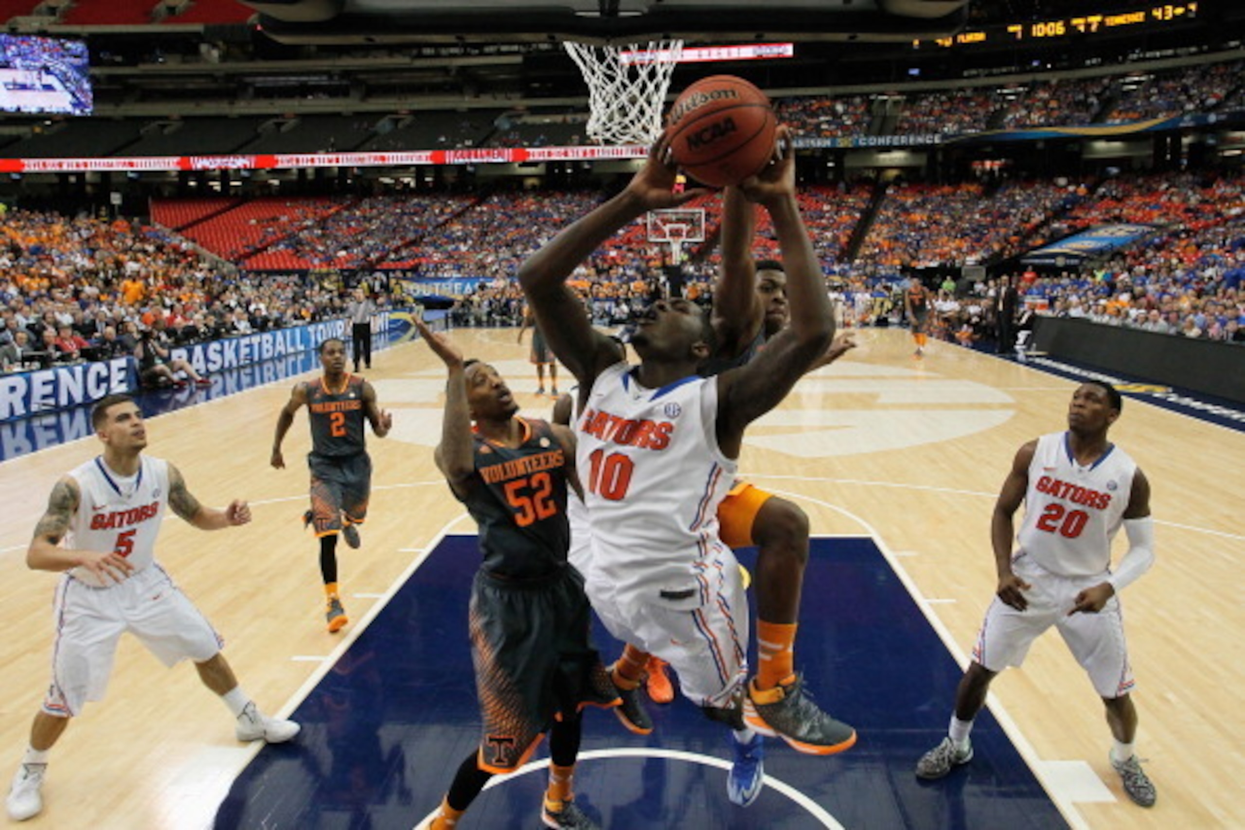 ATLANTA, GA - MARCH 15:  Armani Moore #4 of the Tennessee Volunteers blocks a shot by Dorian Finney-Smith #10 of the Florida Gators during the semifinals of the SEC Men's Basketball Tournament at Georgia Dome on March 15, 2014 in Atlanta, Georgia.  (Photo