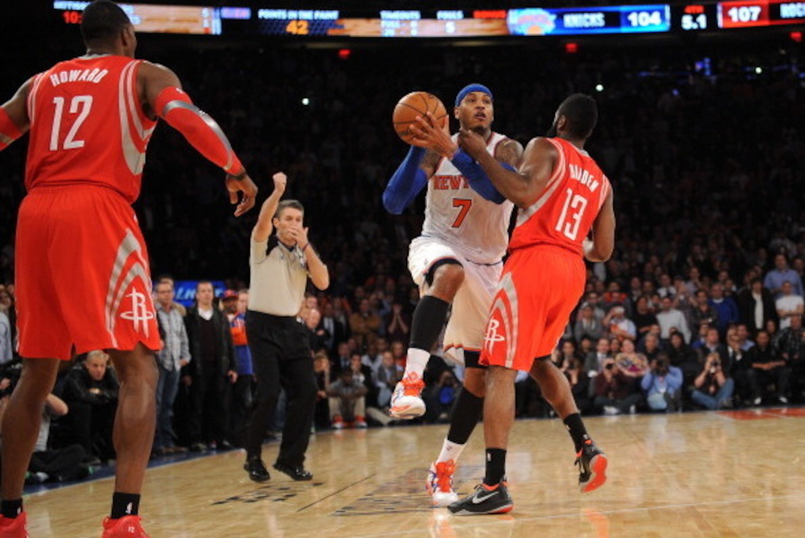 NEW YORK, NY - NOVEMBER 14: A personal foul is called on James Harden #13 of the Houston Rockets while  Carmelo Anthony #7 of the New York Knicks  takes a shot with five seconds left in the game at Madison Square Garden on November 14, 2013 in New York Ci