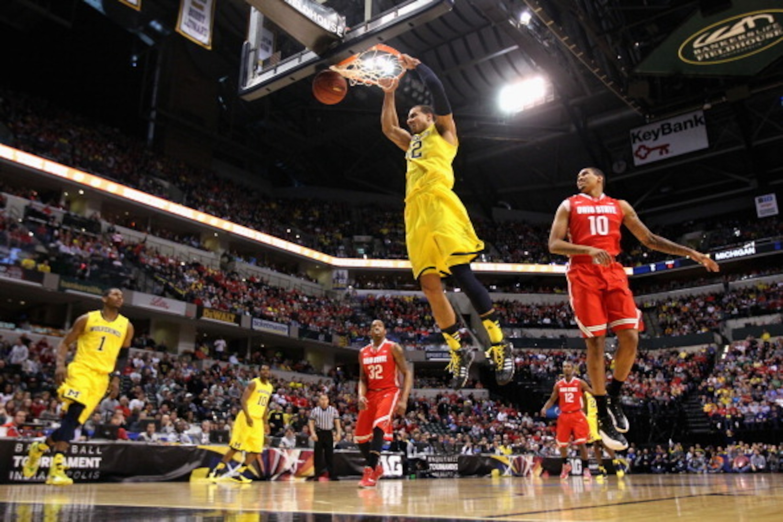 INDIANAPOLIS, IN - MARCH 15:  Jordan Morgan #52 of the Michigan Wolverines dunks the ball during the first half of the Big Ten Basketball Tournament Semifinal game against the Ohio State Buckeyes at Bankers Life Fieldhouse on March 15, 2014 in Indianapoli