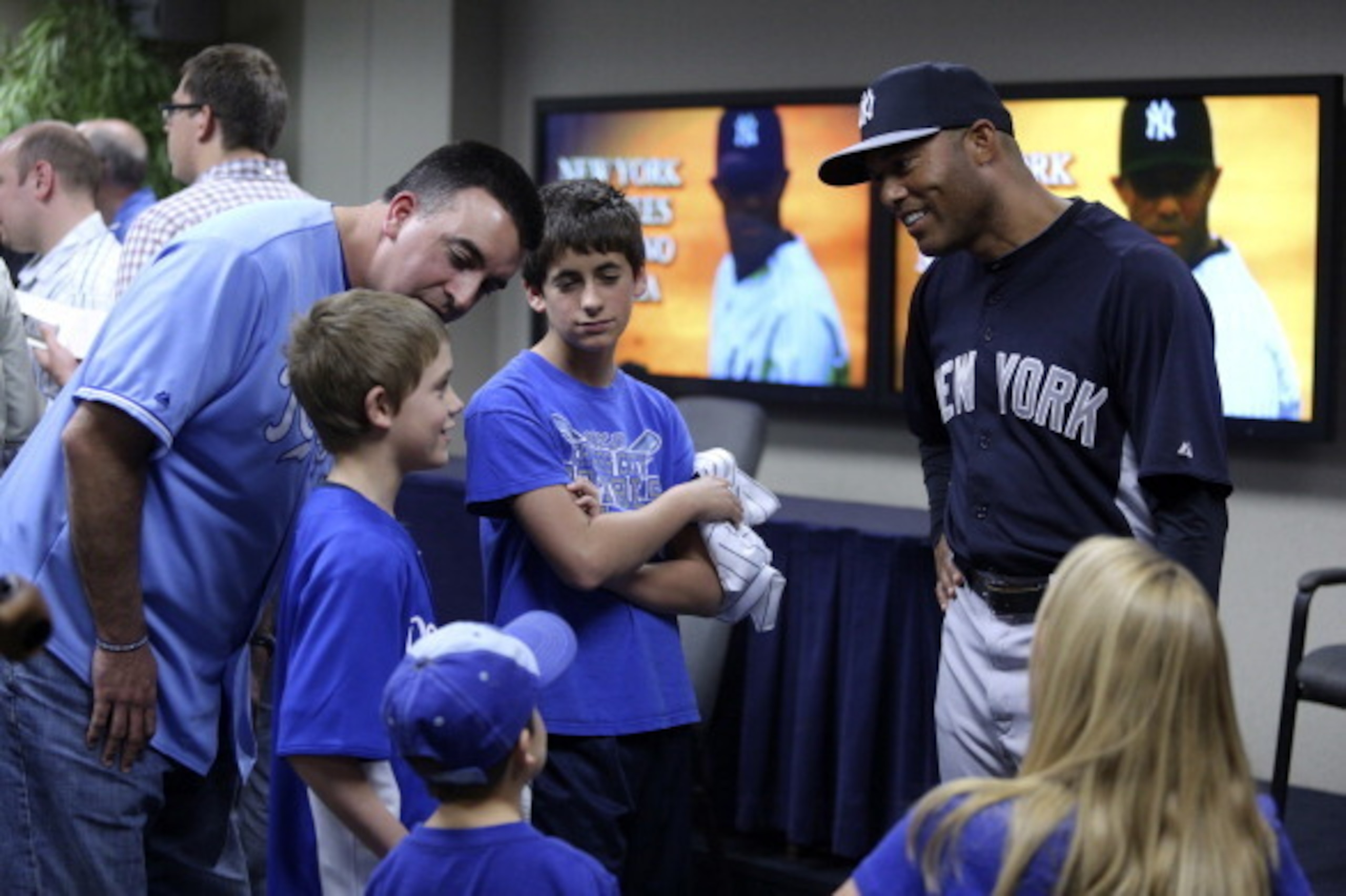 KANSAS CITY, MO - MAY 11:  Mariano Rivera #42 of the New York Yankees talks with members of the Bresette family prior to a game against the Kansas City Royals at Kauffman Stadium on May 11, 2013 in Kansas City, Missouri. In March, an information sign at B