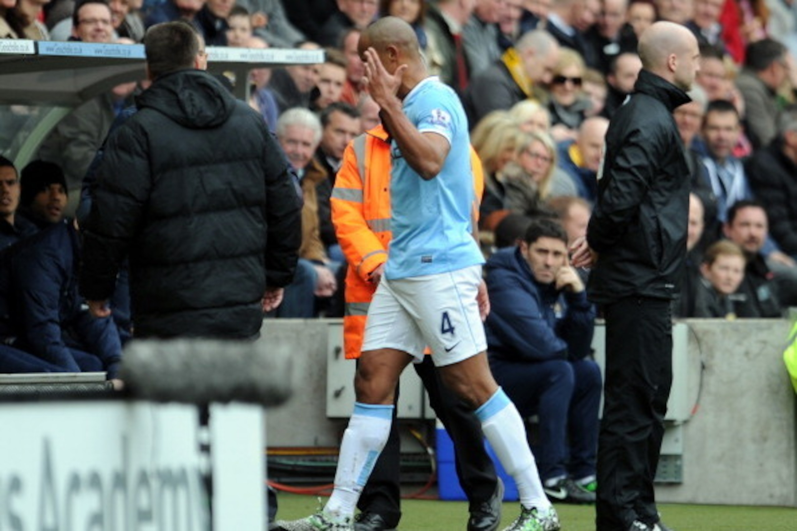 HULL, ENGLAND - MARCH 15:  Vincent Kompany of Manchester City gestures with his hand as he leaves the field after being shown a red card during the Barclays Premier League match between Hull City and Manchester City at the KC Stadium on March 15, 2014 in 