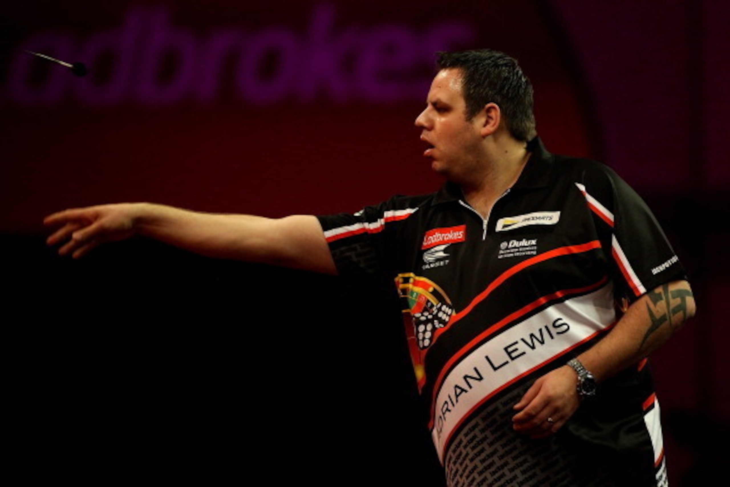 LONDON, ENGLAND - DECEMBER 29: Adrian Lewis of England in action during his quarter final match against James Wade of England on day fourteen of the Ladbrokes.com World Darts Championship at Alexandra Palace on December 29, 2013 in London, England.  (Phot