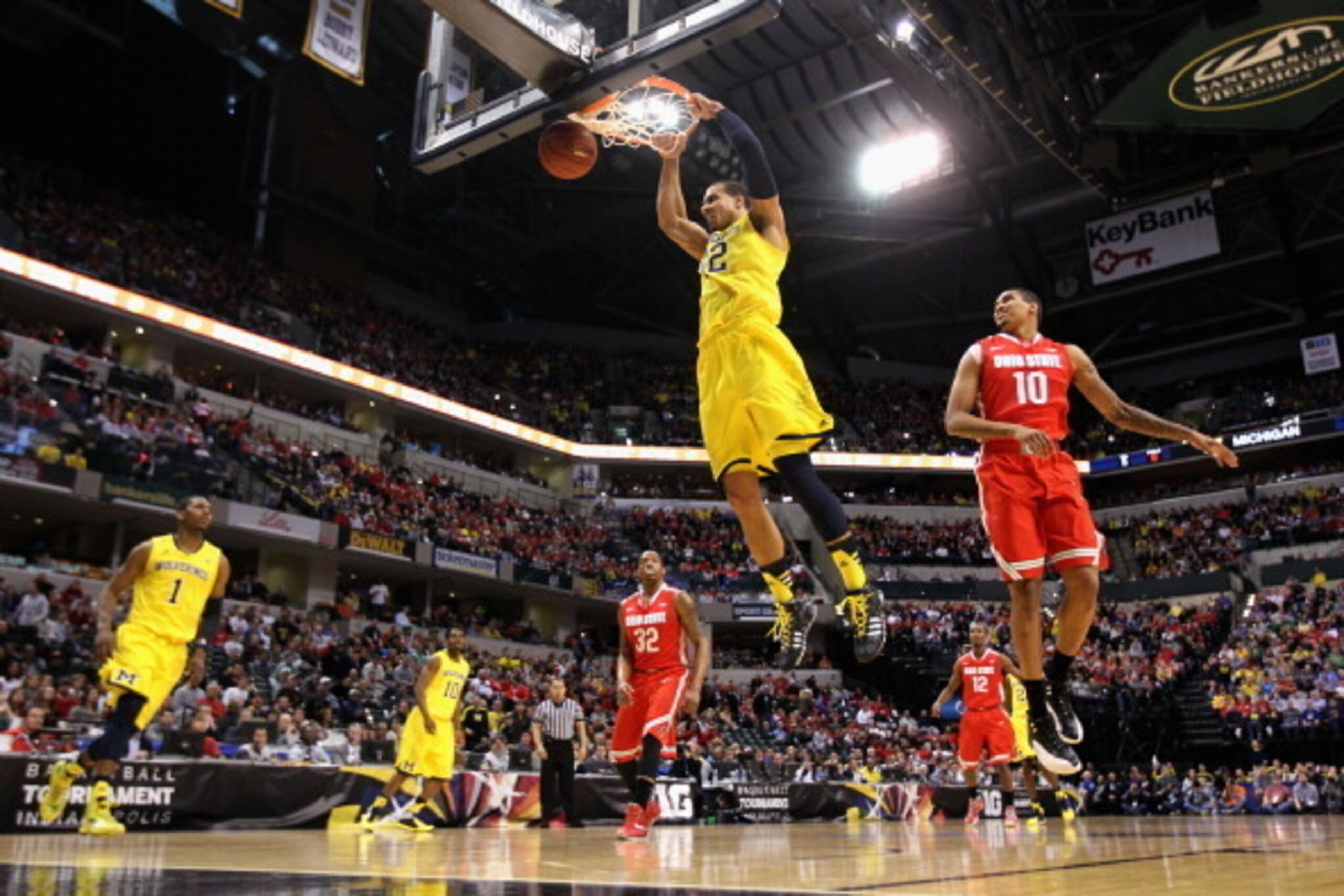 INDIANAPOLIS, IN - MARCH 15:  Jordan Morgan #52 of the Michigan Wolverines dunks the ball during the first half of the Big Ten Basketball Tournament Semifinal game against the Ohio State Buckeyes at Bankers Life Fieldhouse on March 15, 2014 in Indianapoli