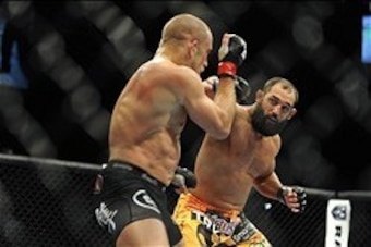 Nov 16, 2013; Las Vegas, NV, USA; Georges St-Pierre (red gloves) fights against Johny Hendricks (blue gloves) in their welterweight championship bout during UFC 167 at MGM Grand Garden Arena. Mandatory Credit: Stephen R. Sylvanie-USA TODAY Sports