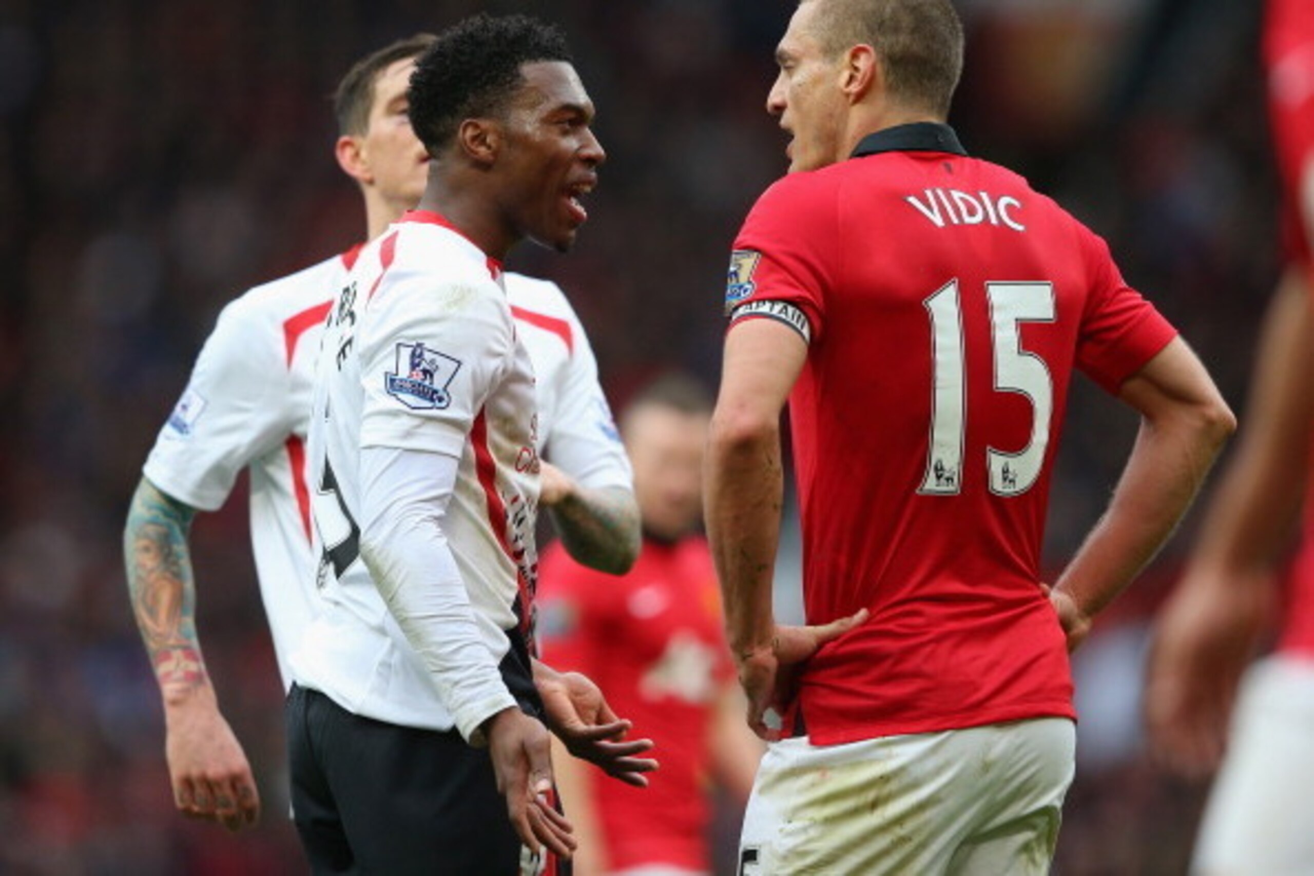 MANCHESTER, ENGLAND - MARCH 16:  Nemanja Vidic of Manchester United has words with Daniel Sturridge of Liverpool after the award of the second penalty kick during the Barclays Premier League match between Manchester United and Liverpool at Old Trafford on