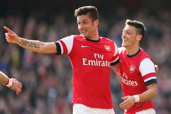 LONDON, ENGLAND - MARCH 08:  Olivier Giroud of Arsenal celebrates with teammate Mesut Oezil after scoring his team's fourth goal during the FA Cup Quarter-Final match between Arsenal and Everton at Emirates Stadium on March 8, 2014 in London, England.  (P