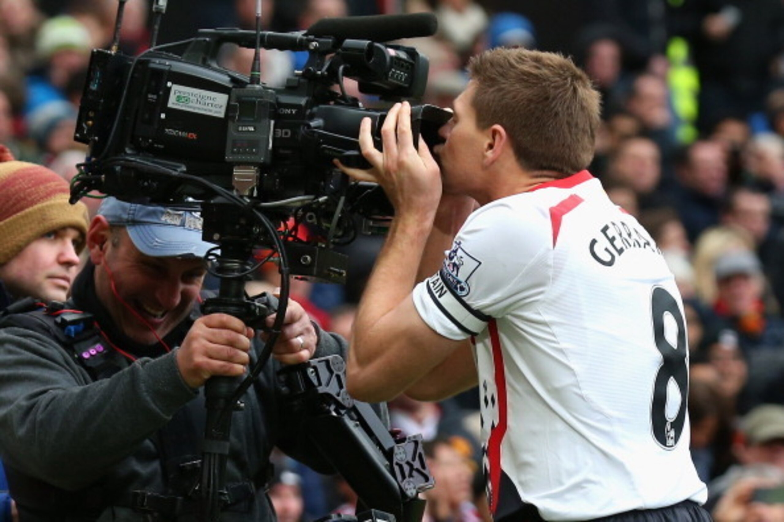 MANCHESTER, ENGLAND - MARCH 16:  Steven Gerrard of Liverpool celebrates scoring the second goal by kissing the steadicam during the Barclays Premier League match between Manchester United and Liverpool at Old Trafford on March 16, 2014 in Manchester, Engl