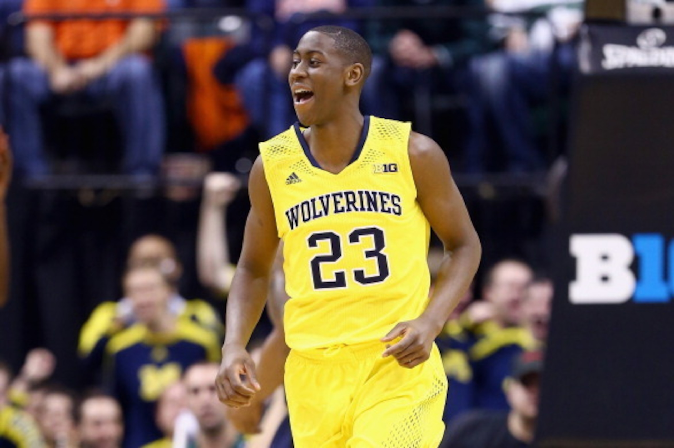 INDIANAPOLIS, IN - MARCH 14:  Caris LeVert #23 of the Michigan Wolverines celebrates in the game against the Illinois Fighting Illini during the Quarterfinals of the Big Ten Basketball Tournament at Bankers Life Fieldhouse on March 14, 2014 in Indianapoli
