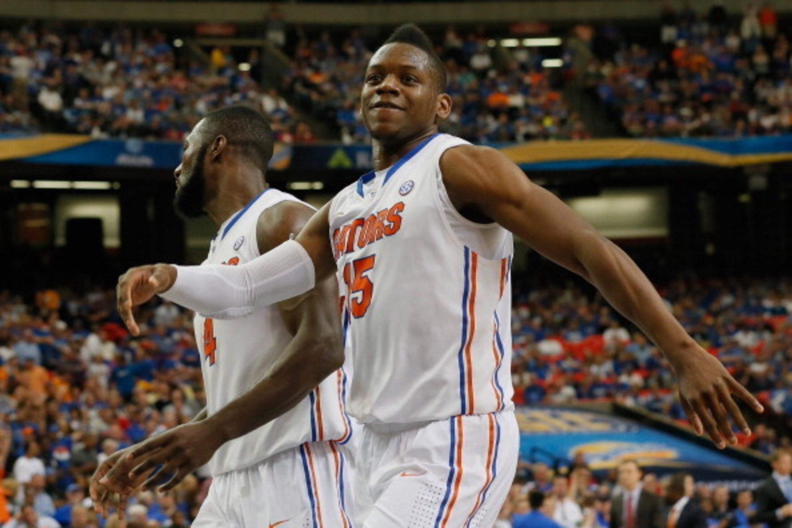 ATLANTA, GA - MARCH 15:  Will Yeguete #15 of the Florida Gators reacts after defeating the Tennessee Volunteers during the semifinals of the SEC Men's Basketball Tournament at Georgia Dome on March 15, 2014 in Atlanta, Georgia.  (Photo by Kevin C. Cox/Get