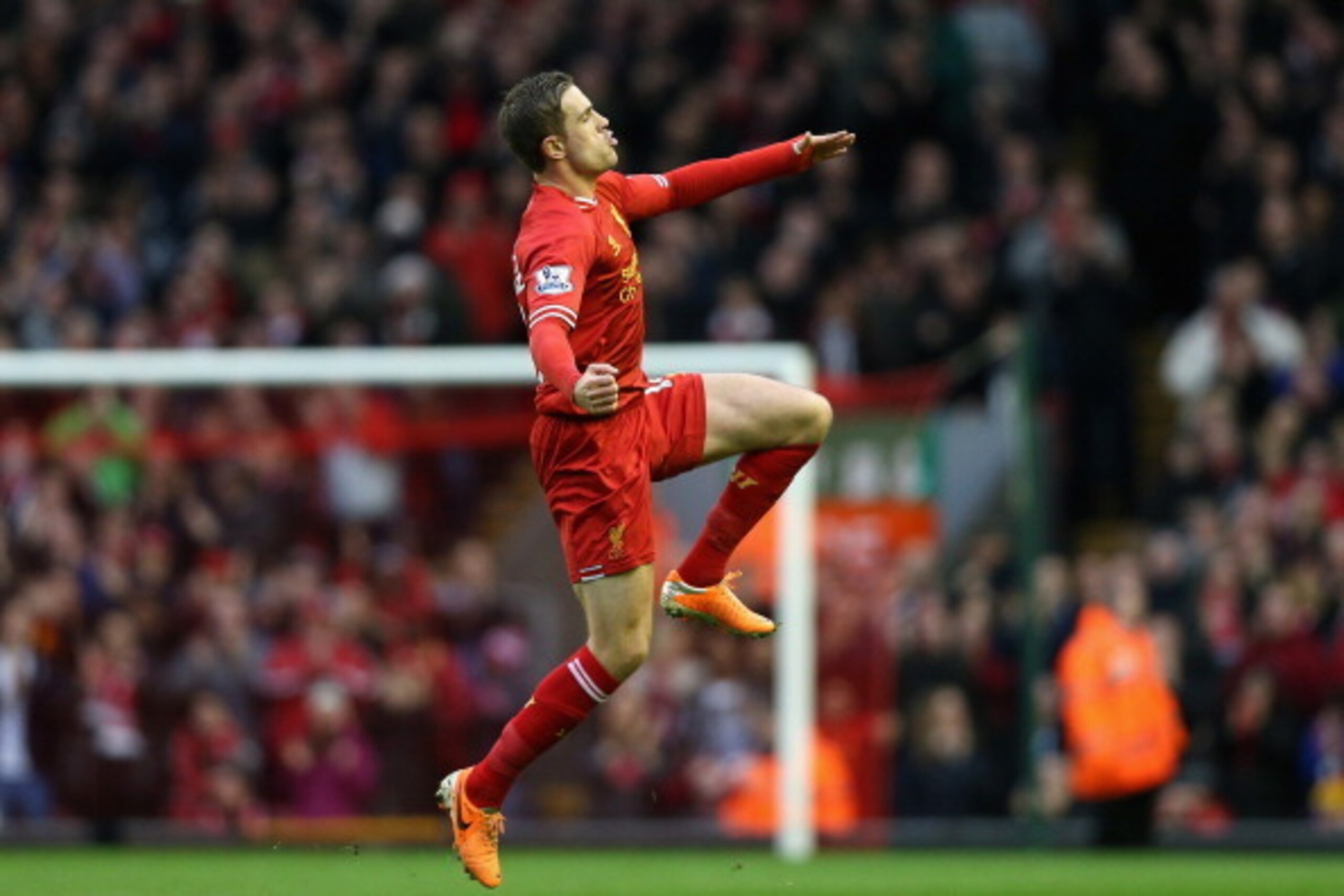 LIVERPOOL, ENGLAND - FEBRUARY 23:  Jordan Henderson of Liverpool celebrates scoring the second goal during the Barclays Premier League match between Liverpool and Swansea City at Anfield on February 23, 2014 in Liverpool, England.  (Photo by Clive Brunski