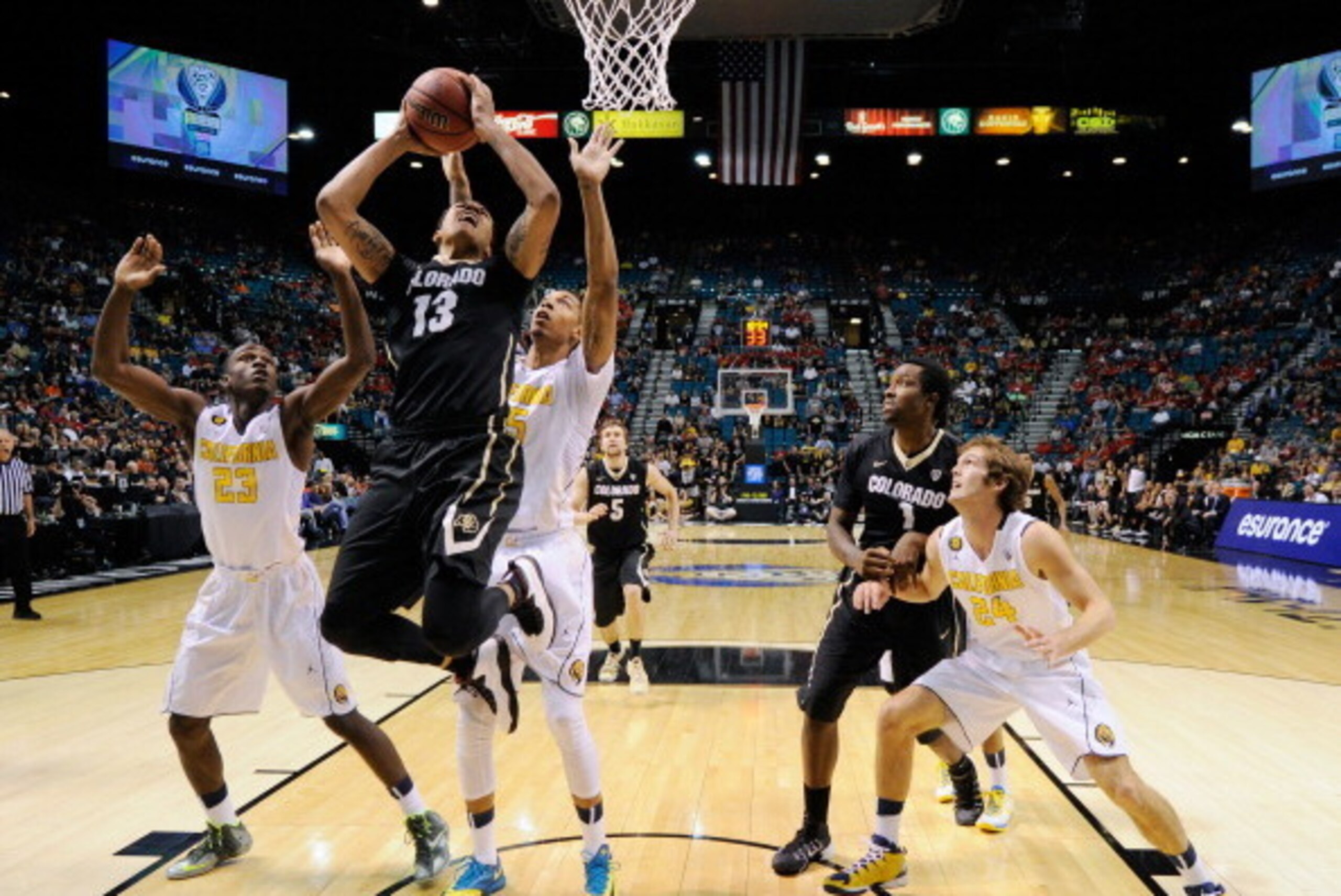 LAS VEGAS, NV - MARCH 13:  Dustin Thomas #13 of the Colorado Buffaloes shoots between Jabari Bird #23 and Richard Solomon #35 of the California Golden Bears during a quarterfinal game of the Pac-12 Basketball Tournament at the MGM Grand Garden Arena on Ma