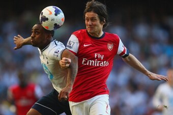 LONDON, ENGLAND - MARCH 16:  Danny Rose of Tottenham Hotspur and Tomas Rosicky of Arsenal battle for the ball during the Barclays Premier League match between Tottenham Hotspur and Arsenal at White Hart Lane on March 16, 2014 in London, England.  (Photo b
