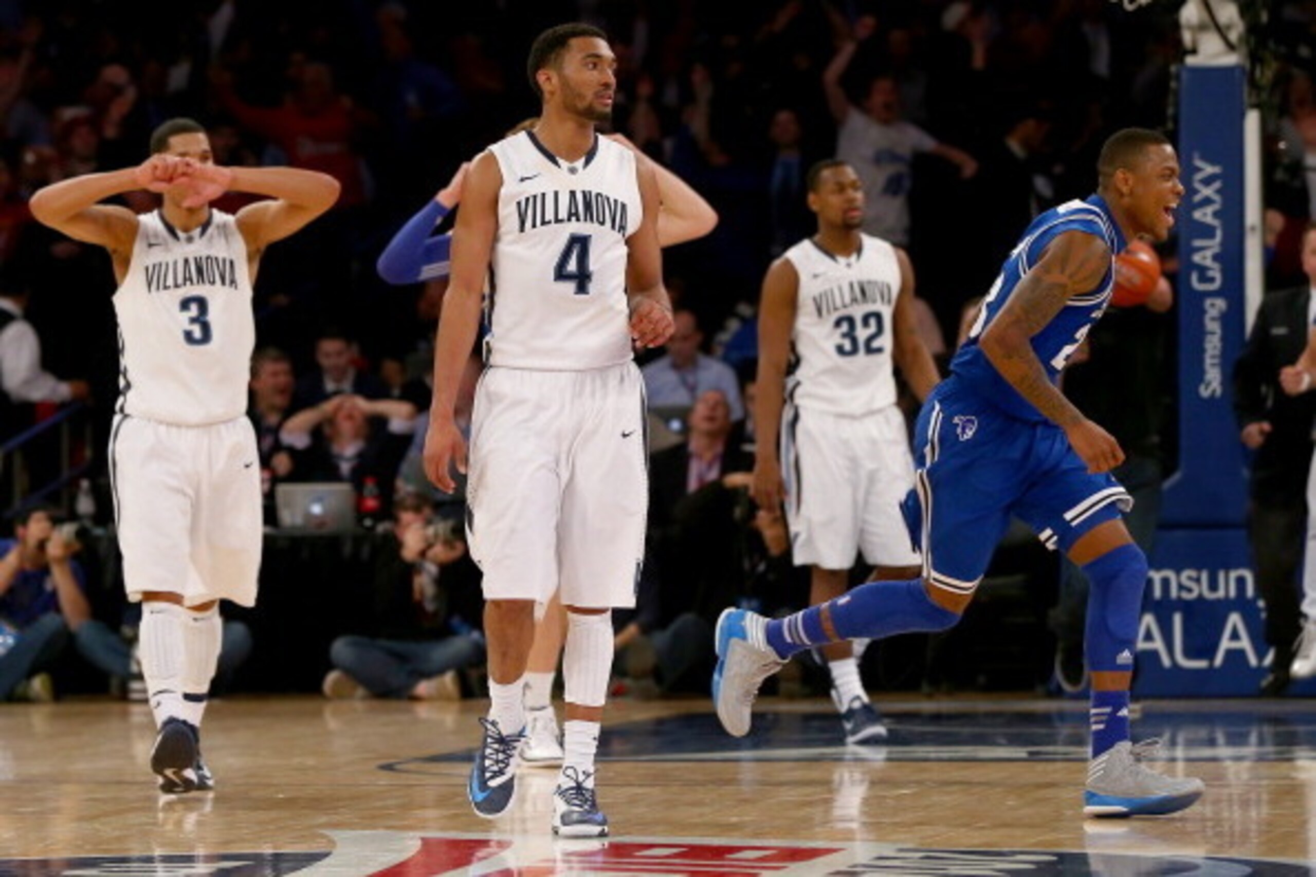 NEW YORK, NY - MARCH 13:  Fuquan Edwin #23 of the Seton Hall Pirates celebrates the win as Josh Hart #3,Darrun Hilliard II #4 and James Bell #32 of the Villanova Wildcats react to the loss during the quarterfinals of the Big East Basketball Tournament at 