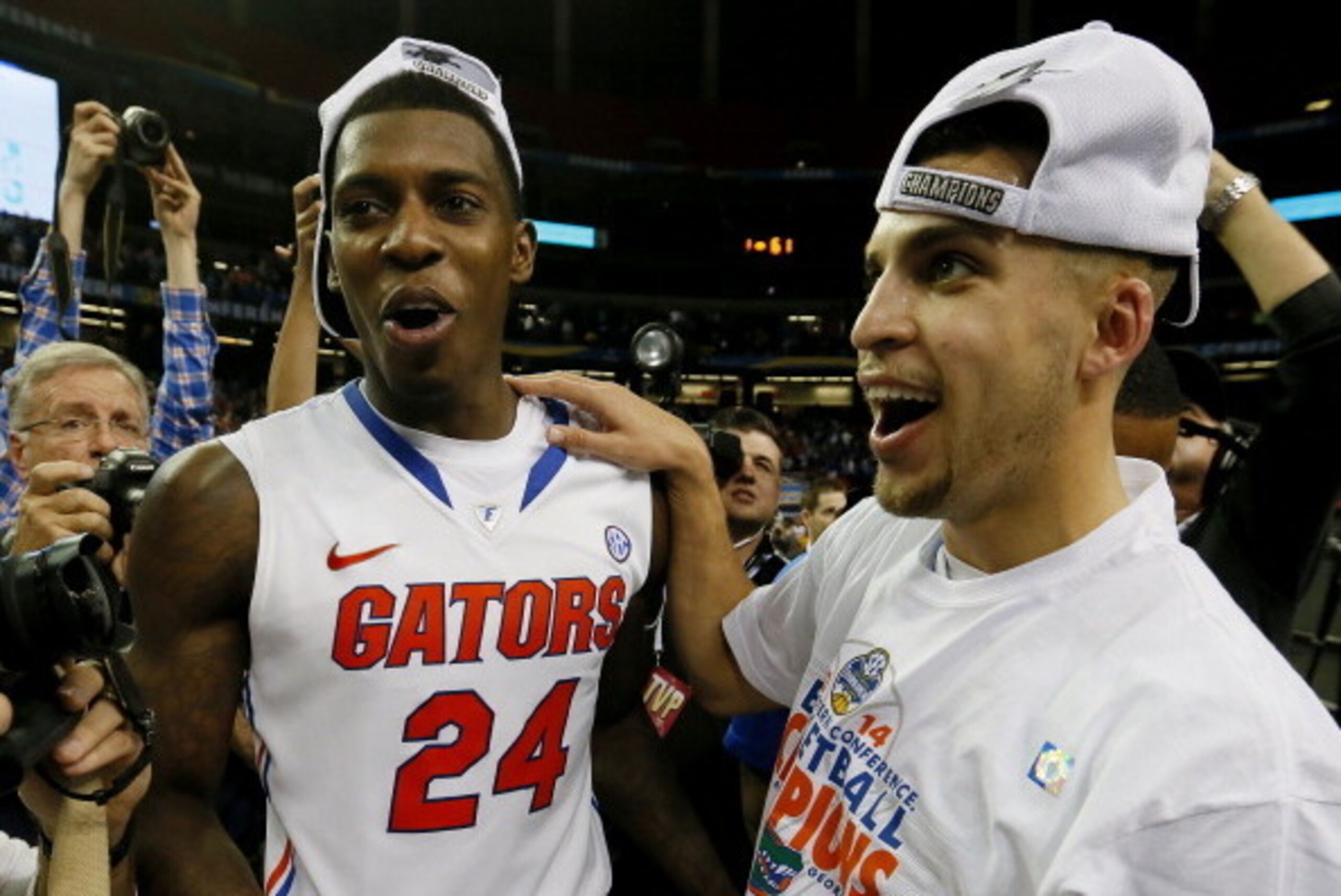 ATLANTA, GA - MARCH 16:  Scottie Wilbekin #5 and Casey Prather #24 of the Florida Gators celebrate their 61 to 60 win over the Kentucky Wildcats in the Championship game of the 2014 Men's SEC Basketball Tournament at Georgia Dome on March 16, 2014 in Atla