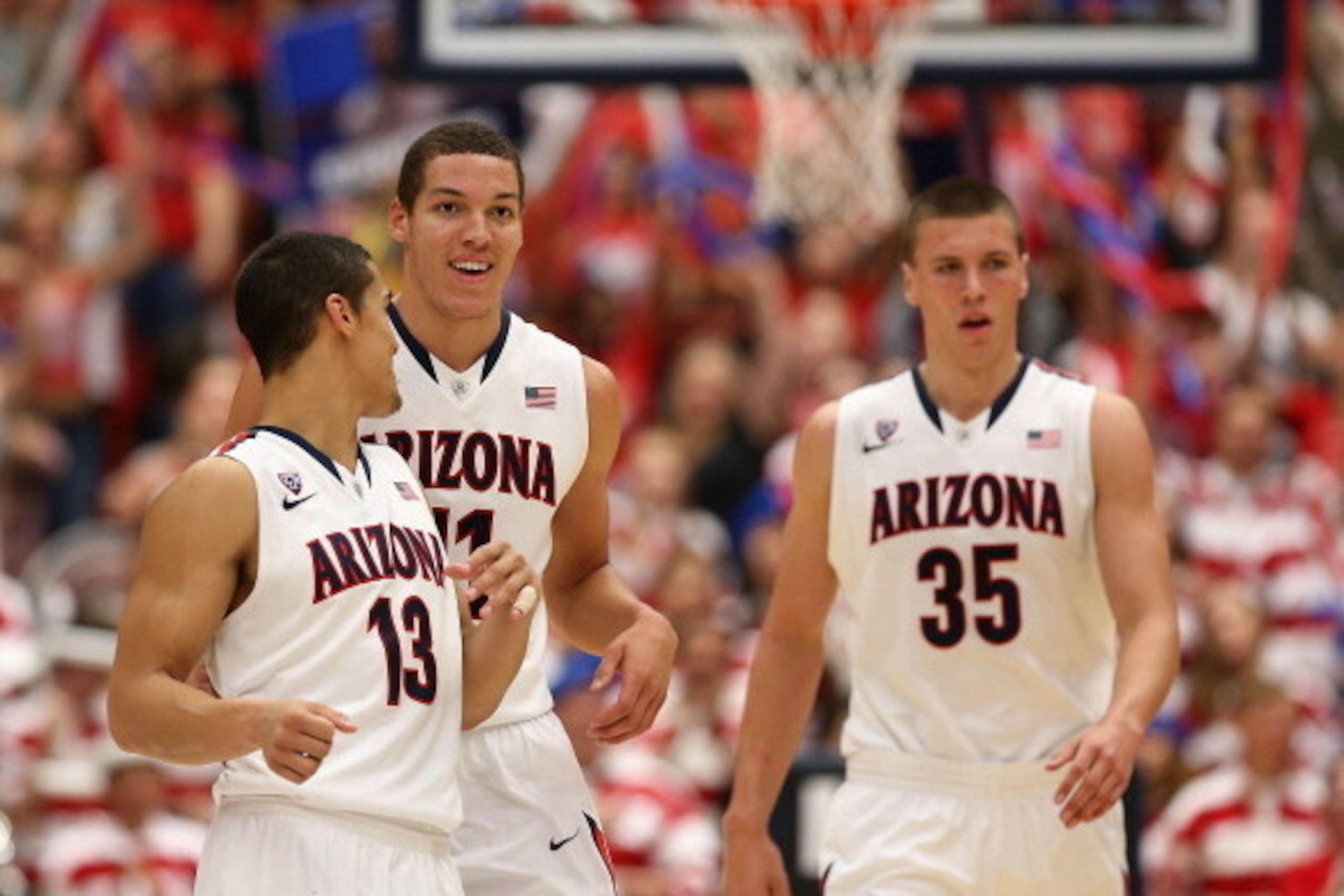 TUCSON, AZ - FEBRUARY 26:  (L-R) Nick Johnson #13, Aaron Gordon #11 and Kaleb Tarczewski #35 of the Arizona Wildcats react after scoring against the California Golden Bears during the second half of the college basketball game at McKale Center on February