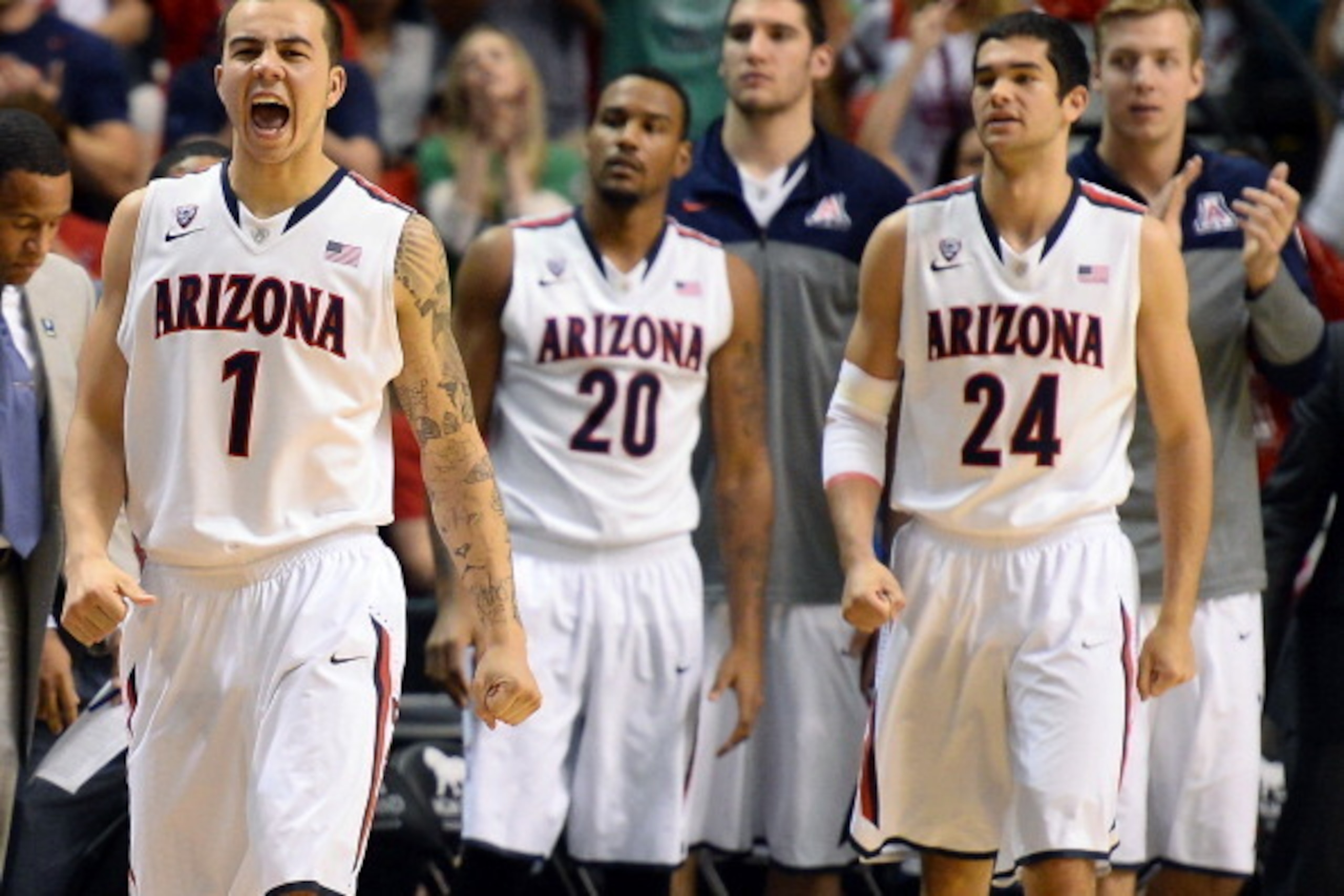LAS VEGAS, NV - MARCH 15:  Gabe York #1 of the Arizona Wildcats reacts as teammates Jordin Mayes #20 and Elliott Pitts #24 look on during a timeout in the championship game of the Pac-12 Basketball Tournament against the UCLA Bruins at the MGM Grand Garde