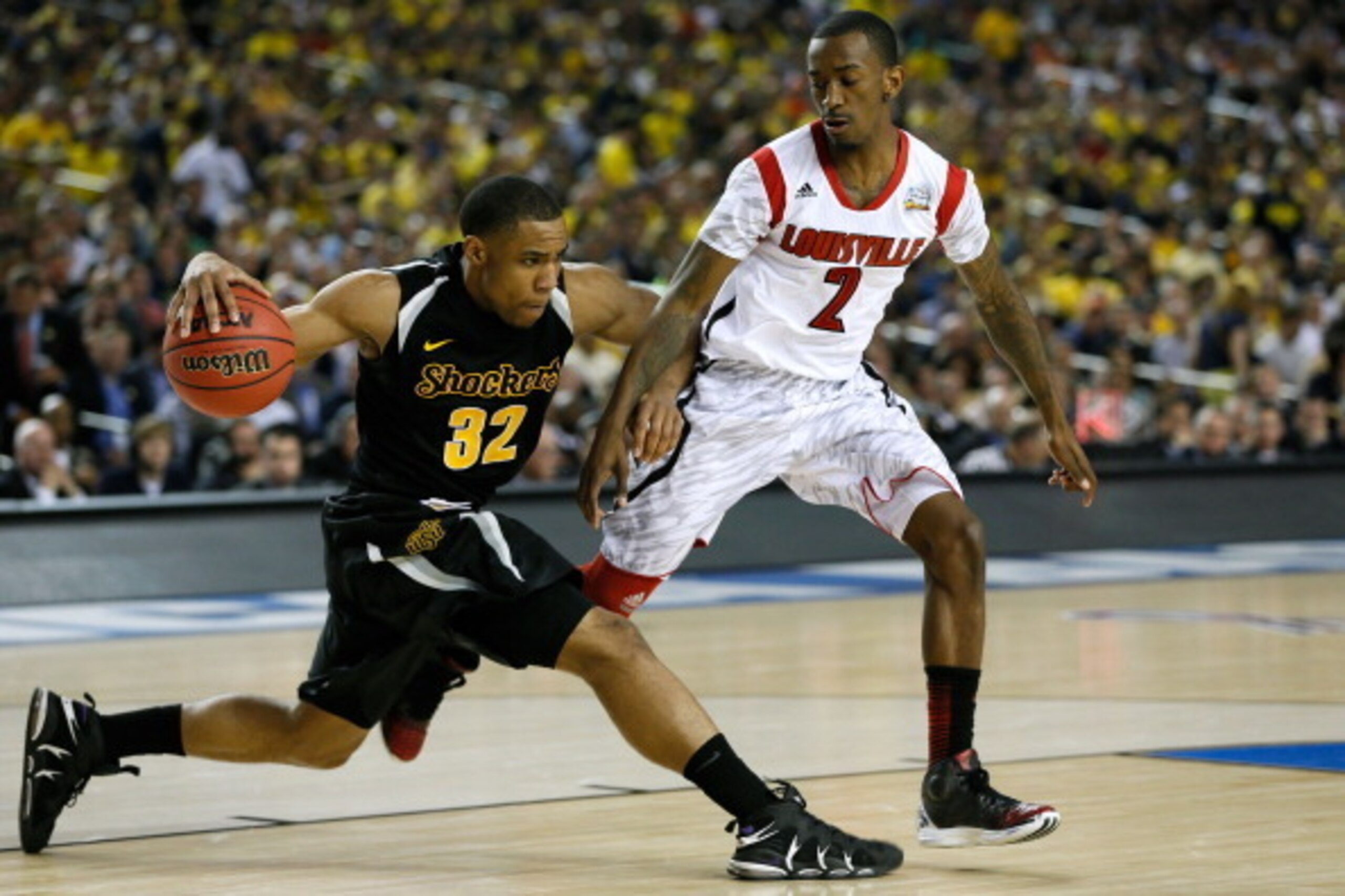 ATLANTA, GA - APRIL 06:  Tekele Cotton #32 of the Wichita State Shockers attempts to bring the ball up court in the second half against Russ Smith #2 of the Louisville Cardinals during the 2013 NCAA Men's Final Four Semifinal at the Georgia Dome on April 