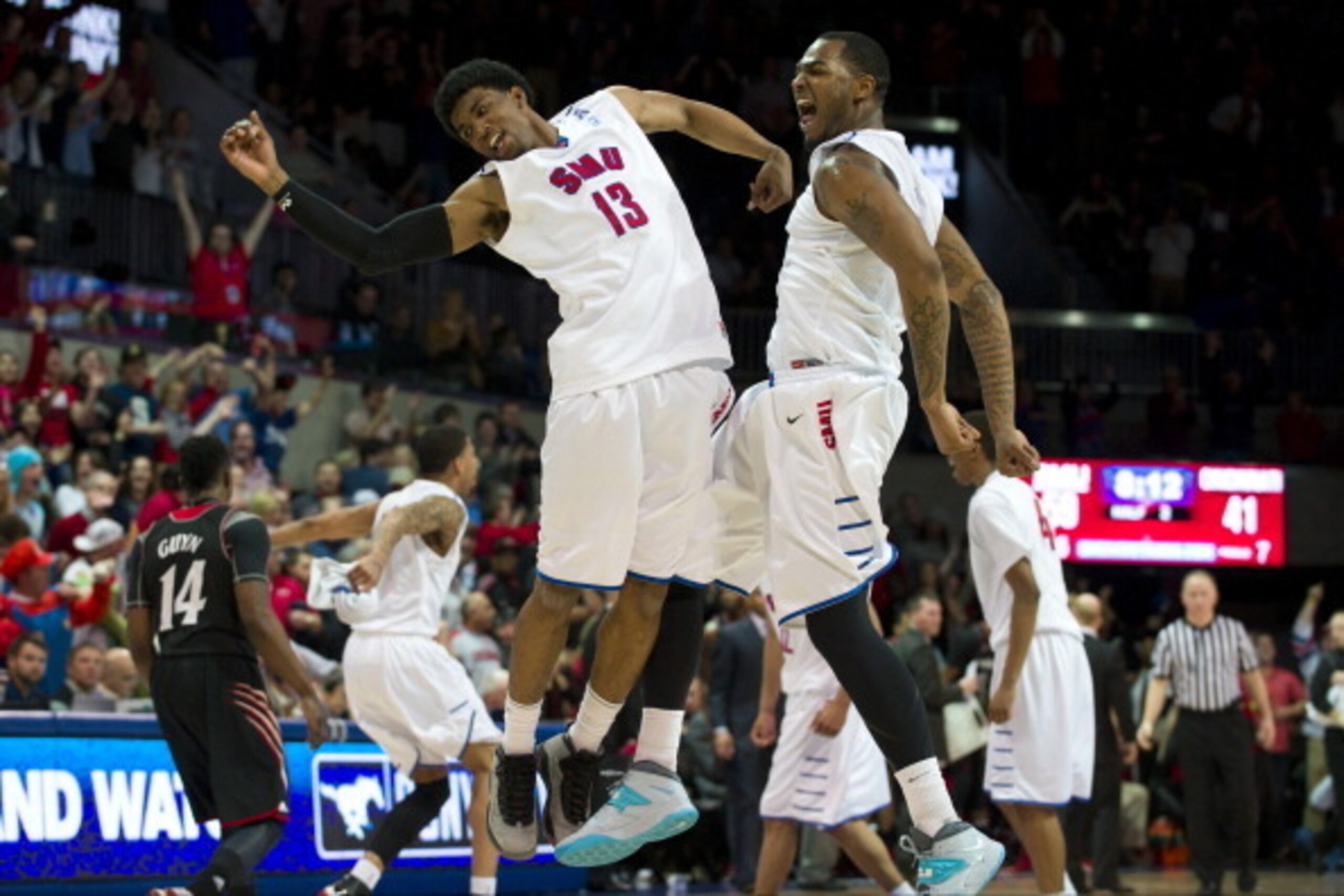 DALLAS, TX - FEBRUARY 8: Crandall Head #13 and Markus Kennedy #5 of the SMU Mustangs celebrate during a timeout against the Cincinnati Bearcats on February 8, 2014 at Moody Coliseum in Dallas, Texas. (Photo by Cooper Neill/Getty Images) DALLAS, TX - FEBRUARY 8: Crandall Head #13 and Markus Kennedy #5 of the SMU Mustangs celebrate during a timeout against the Cincinnati Bearcats on February 8, 2014 at Moody Coliseum in Dallas, Texas. (Photo by Cooper Neill/Getty Images)
