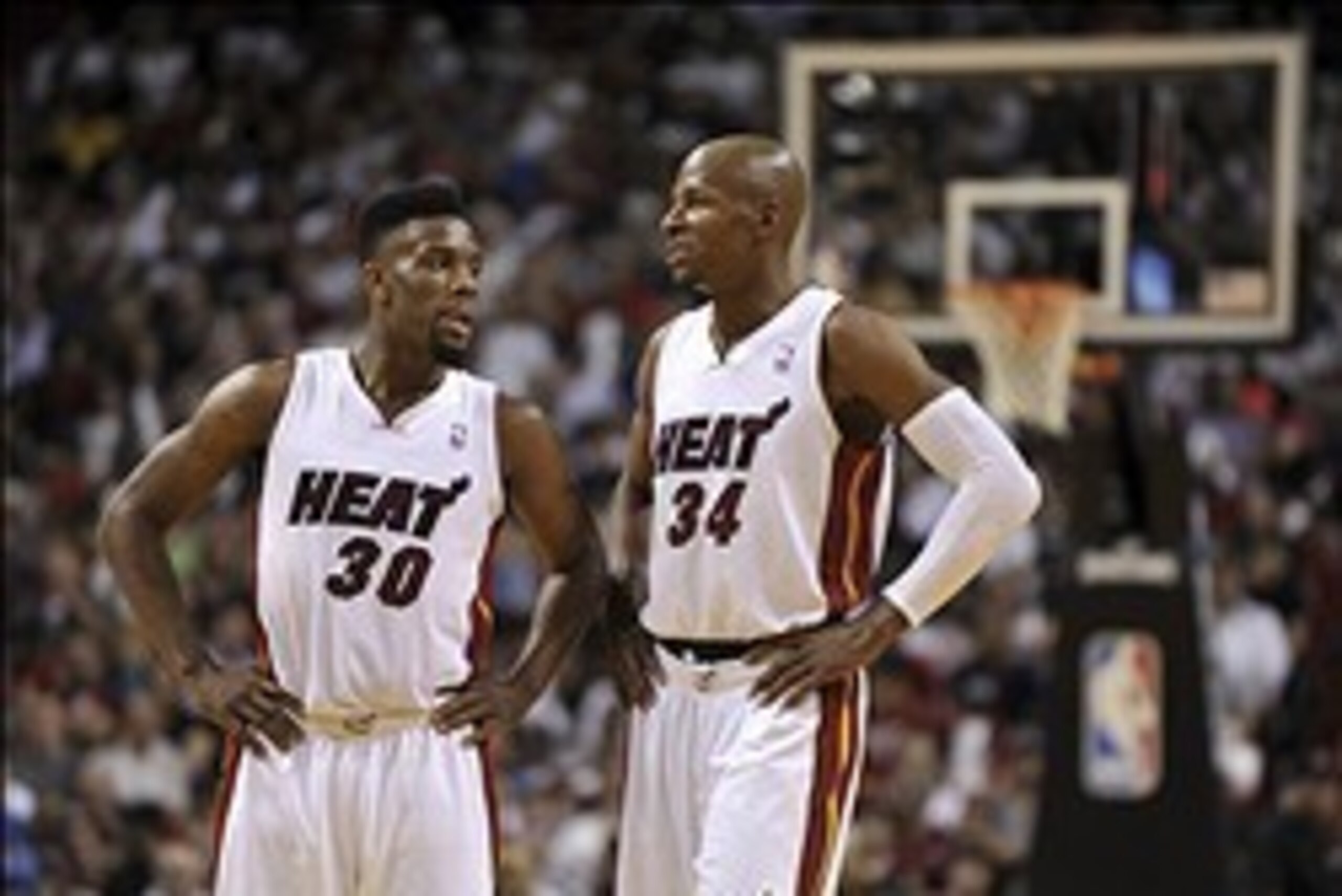 Mar 16, 2014; Miami, FL, USA; Miami Heat guard Norris Cole (left) chats with teammate guard Ray Allen (right) during the second half against the Houston Rockets at American Airlines Arena. Mandatory Credit: Steve Mitchell-USA TODAY Sports