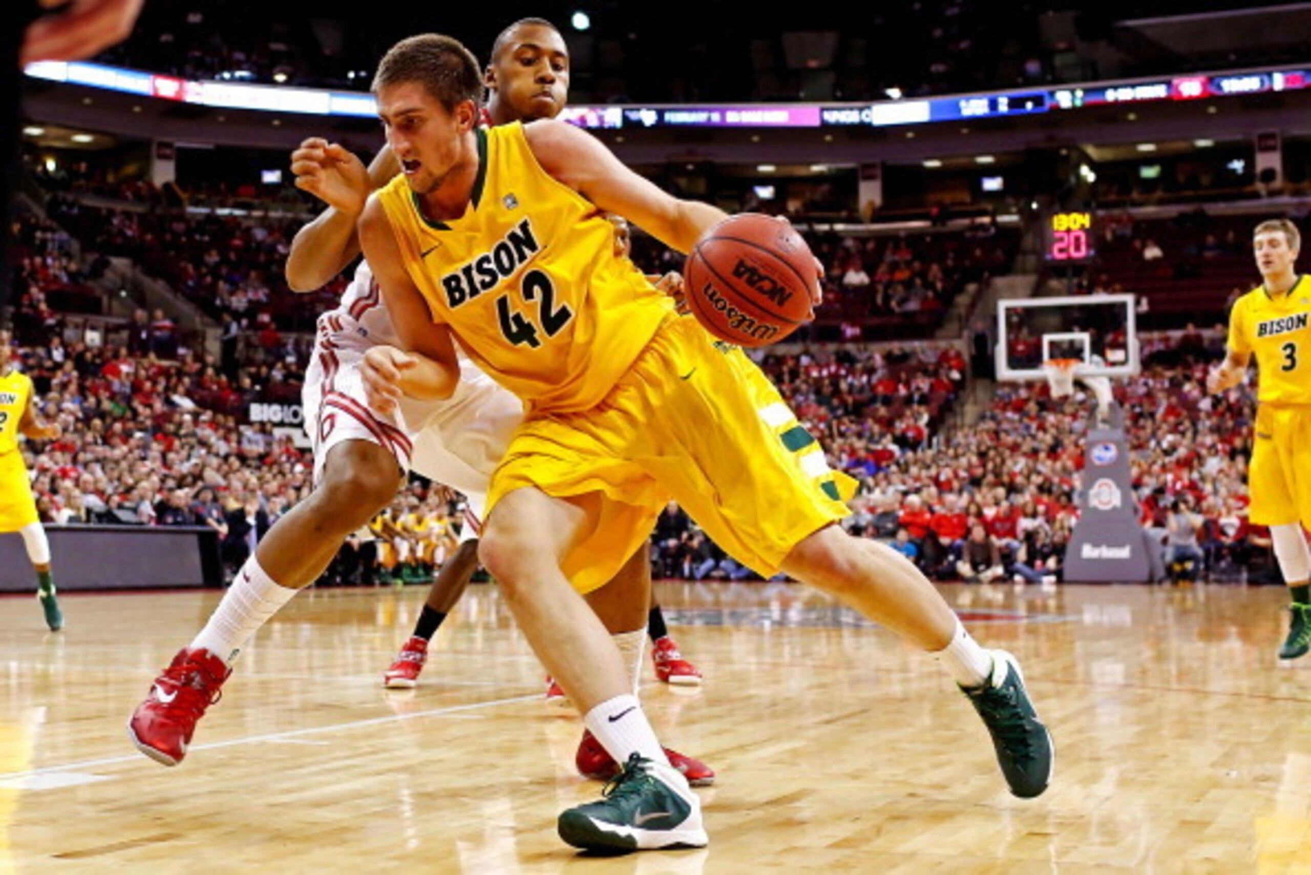 COLUMBUS, OH - DECEMBER 14: Marshall Bjorklund #42 of the North Dakota State Bison drives against Trey McDonald #55 of the Ohio State Buckeyes during the first half at Value City Arena on December 14, 2013 in Columbus, Ohio. (Photo by Kirk Irwin/Getty Im COLUMBUS, OH - DECEMBER 14: Marshall Bjorklund #42 of the North Dakota State Bison drives against Trey McDonald #55 of the Ohio State Buckeyes during the first half at Value City Arena on December 14, 2013 in Columbus, Ohio. (Photo by Kirk Irwin/Getty Im