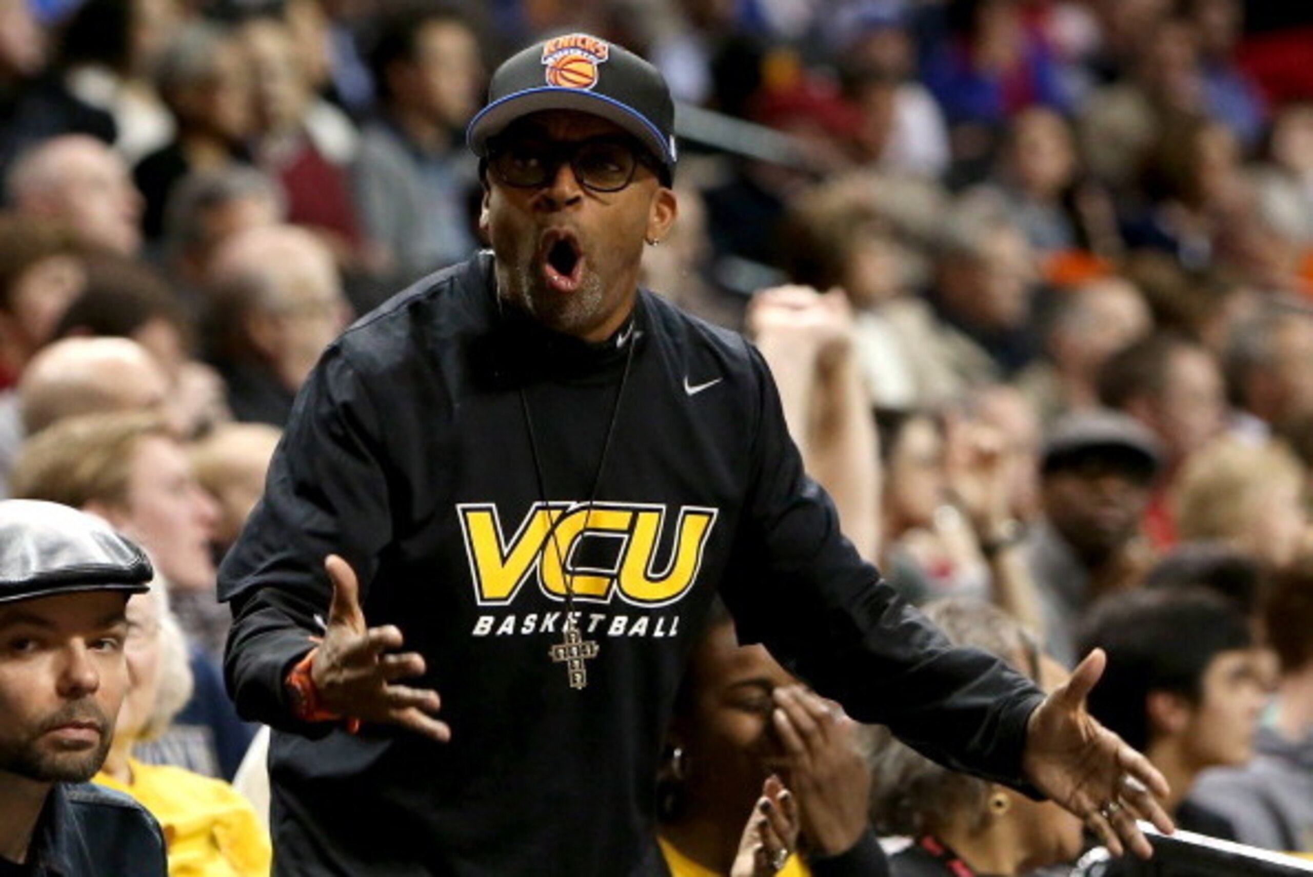 NEW YORK, NY - MARCH 16:  Director Spike Lee yells to the refs in the first half of the game between the Virginia Commonwealth Rams and the Saint Joseph's Hawks during the Championship game of the 2014 Atlantic 10 Men's Basketball Tournament at Barclays C
