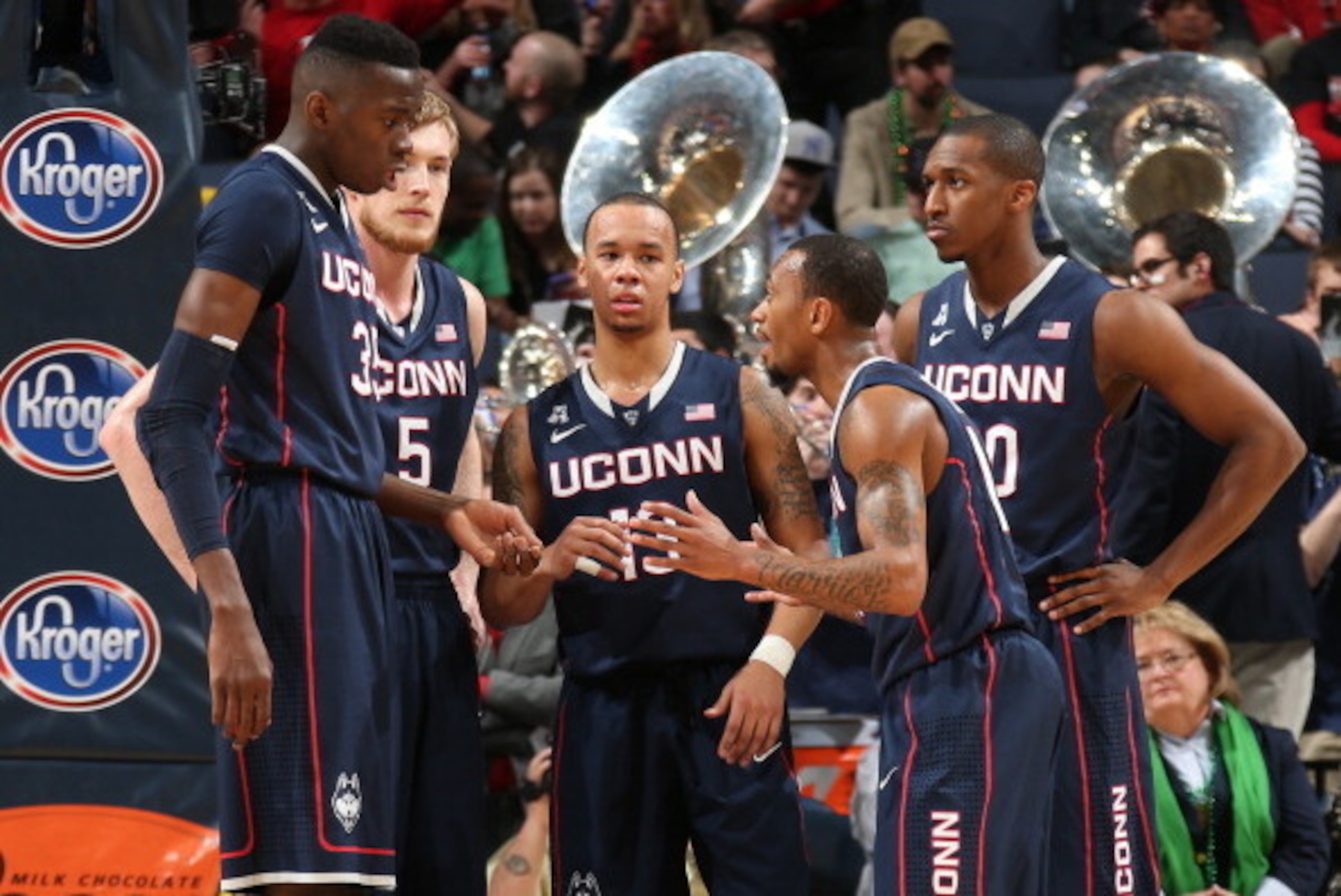 MEMPHIS, TN - MARCH 15: Amida Brimah #35, Niels Giffey #5, Shabazz Napier #13, Ryan Boatright #11 and Lasan Kromah #20 of the Connecticut Huskies huddle together against the Louisville Cardinals during the Championship of the American Athletic Conference 