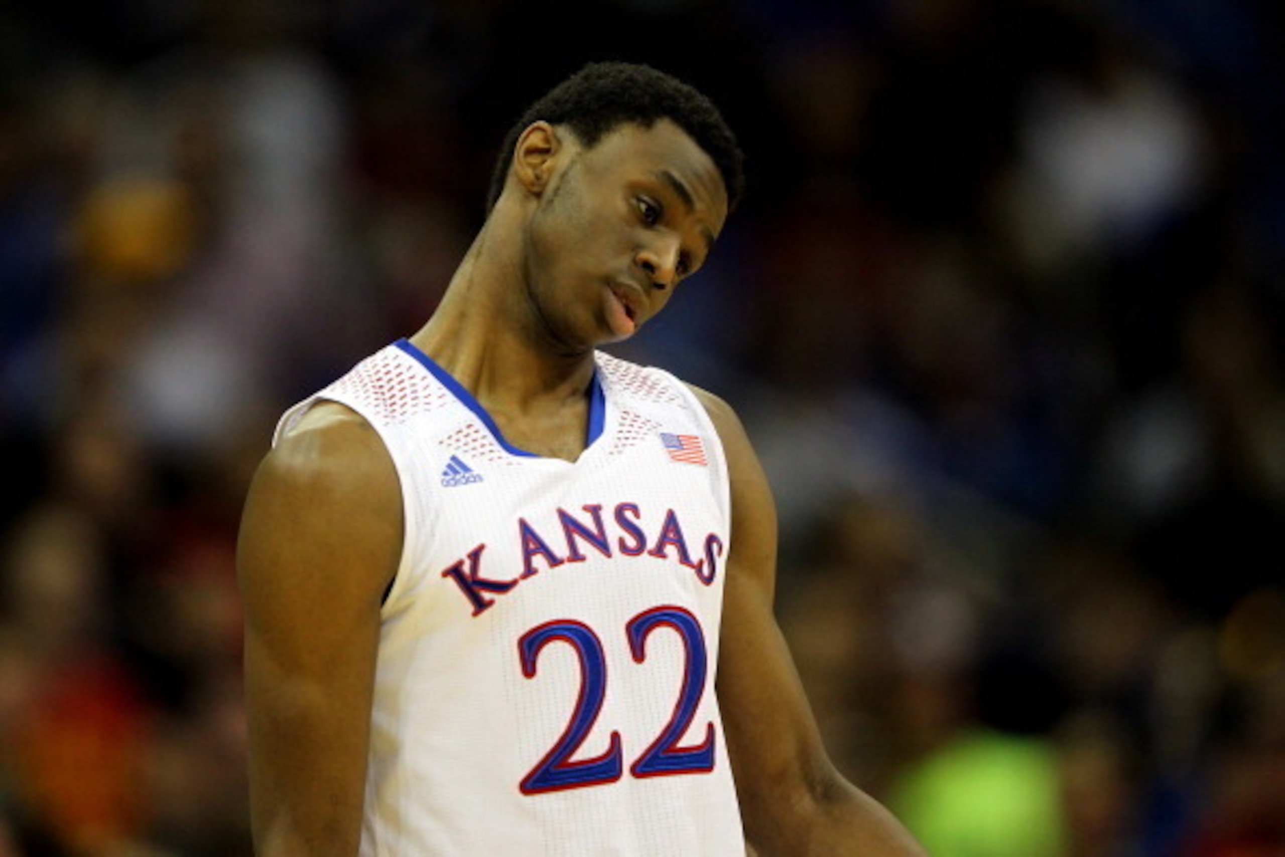 KANSAS CITY, MO - MARCH 14:  Andrew Wiggins #22 of the Kansas Jayhawks walks off the court after the Jayhawks were deated by the Iowa State Cyclones in the Big 12 Basketball Tournament semifinal game at Sprint Center on March 14, 2014 in Kansas City, Miss