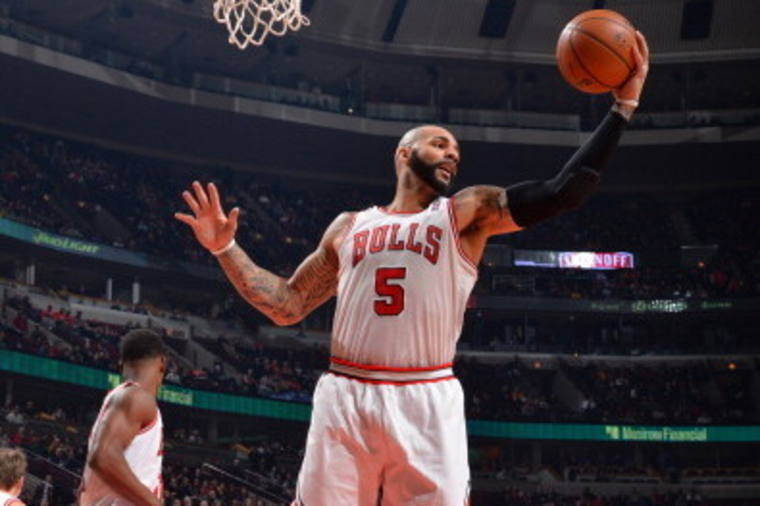 CHICAGO, IL - JANUARY 20: Carlos Boozer #5 of the Chicago Bulls grabs a rebound during the game against the Los Angeles Lakers on January 20, 2014 at the United Center in Chicago, Illinois. NOTE TO USER: User expressly acknowledges and agrees that, by dow