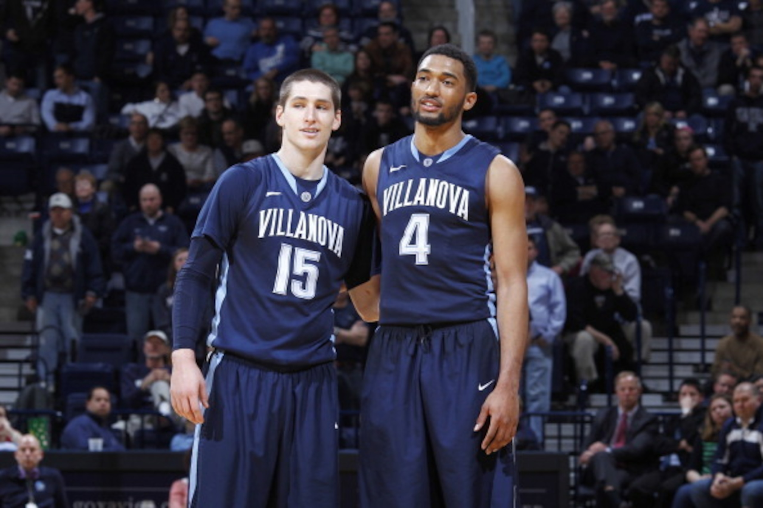 CINCINNATI, OH - MARCH 6: Darrun Hilliard #4 and Ryan Arcidiacono #15 of the Villanova Wildcats celebrate in the closing seconds of the game against the Xavier Musketeers at Cintas Center on March 6, 2014 in Cincinnati, Ohio. Villanova defeated Xavier 77-