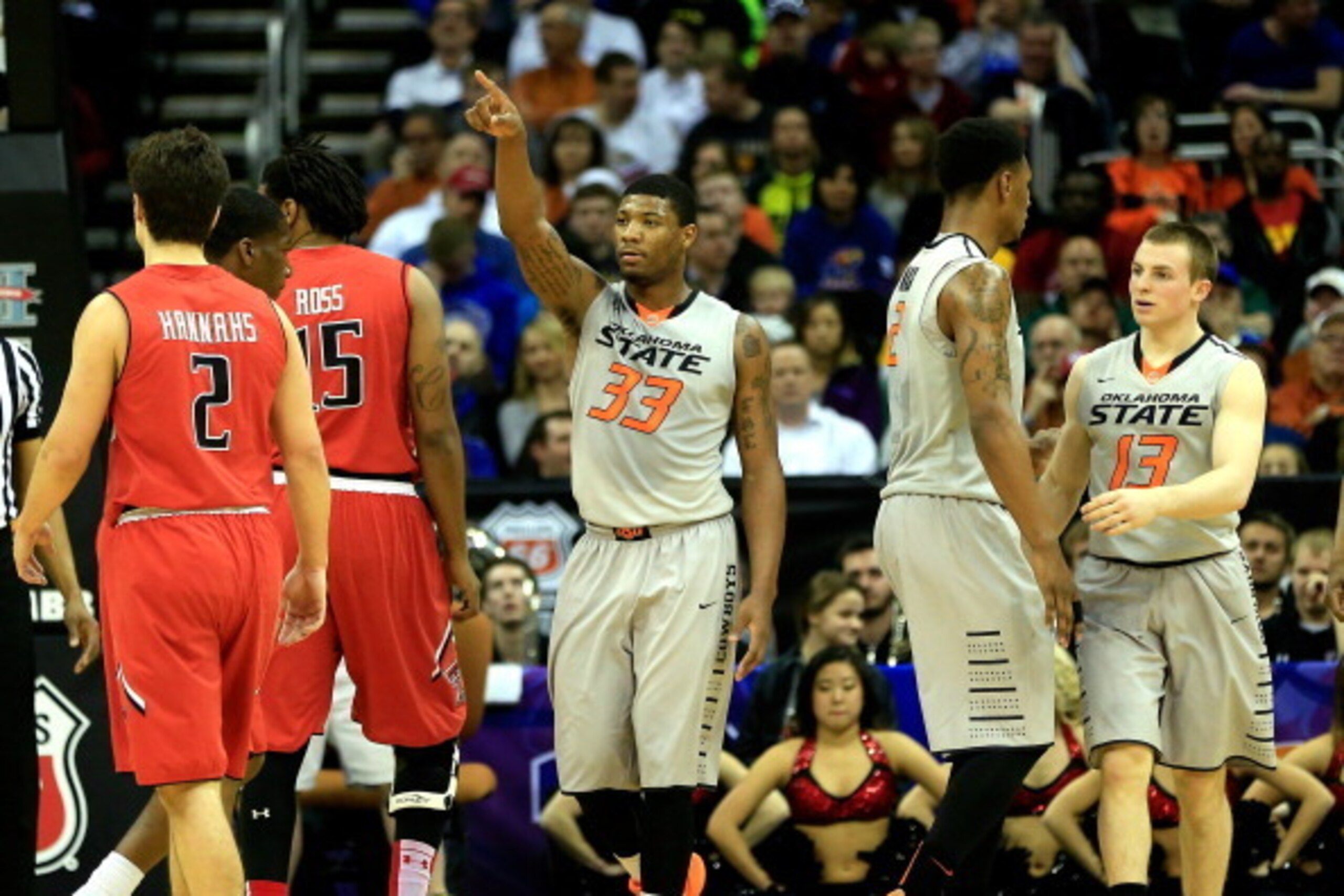 KANSAS CITY, MO - MARCH 12:  Marcus Smart #33 of the Oklahoma State Cowboys reacts after scoring during the Big 12 Basketball Tournament first round game against the Texas Tech Red Raiders at the Sprint Center on March 12, 2014 in Kansas City, Missouri.  