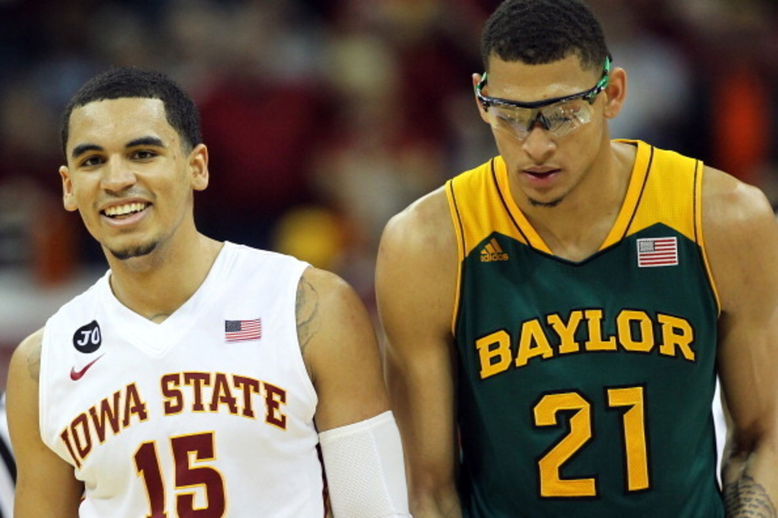 KANSAS CITY, MO - MARCH 15:  Naz Long #15 of the Iowa State Cyclones smiles as Isaiah Austin #21 of the Baylor Bears looks down as time runs out during the Big 12 Basketball Tournament final game at the Sprint Center on March 15, 2014 in Kansas City, Miss