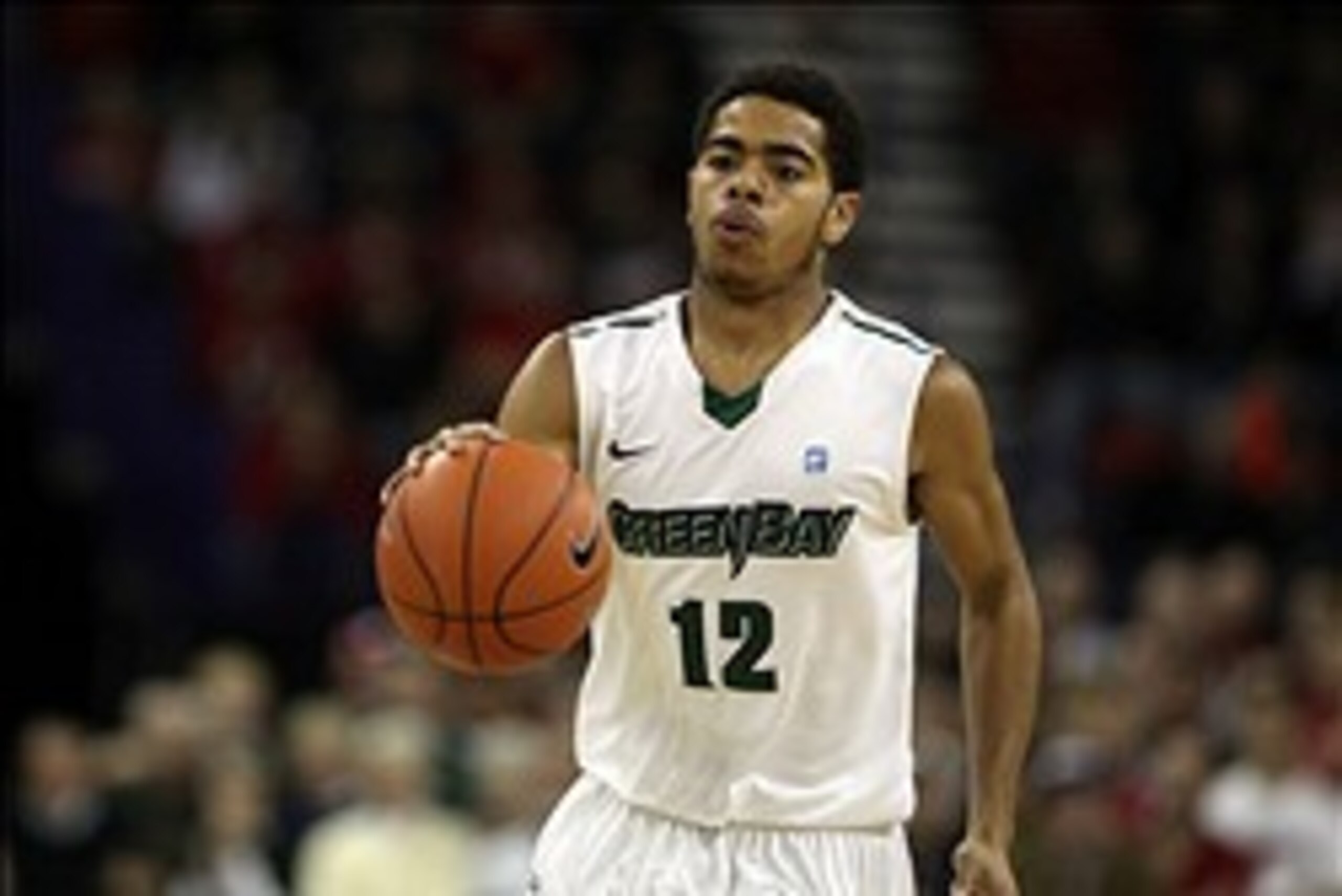 Nov 16, 2013; Green Bay, WI, USA; Wisconsin-Green Bay Phoenix guard Carrington Love (12) takes the ball down the floor as his team plays the Wisconsin Badgers at the Resch Center in Ashwaubenon. Wisconsin defeated Wisconsin-Green Bay 69-66. Mandatory Cred
