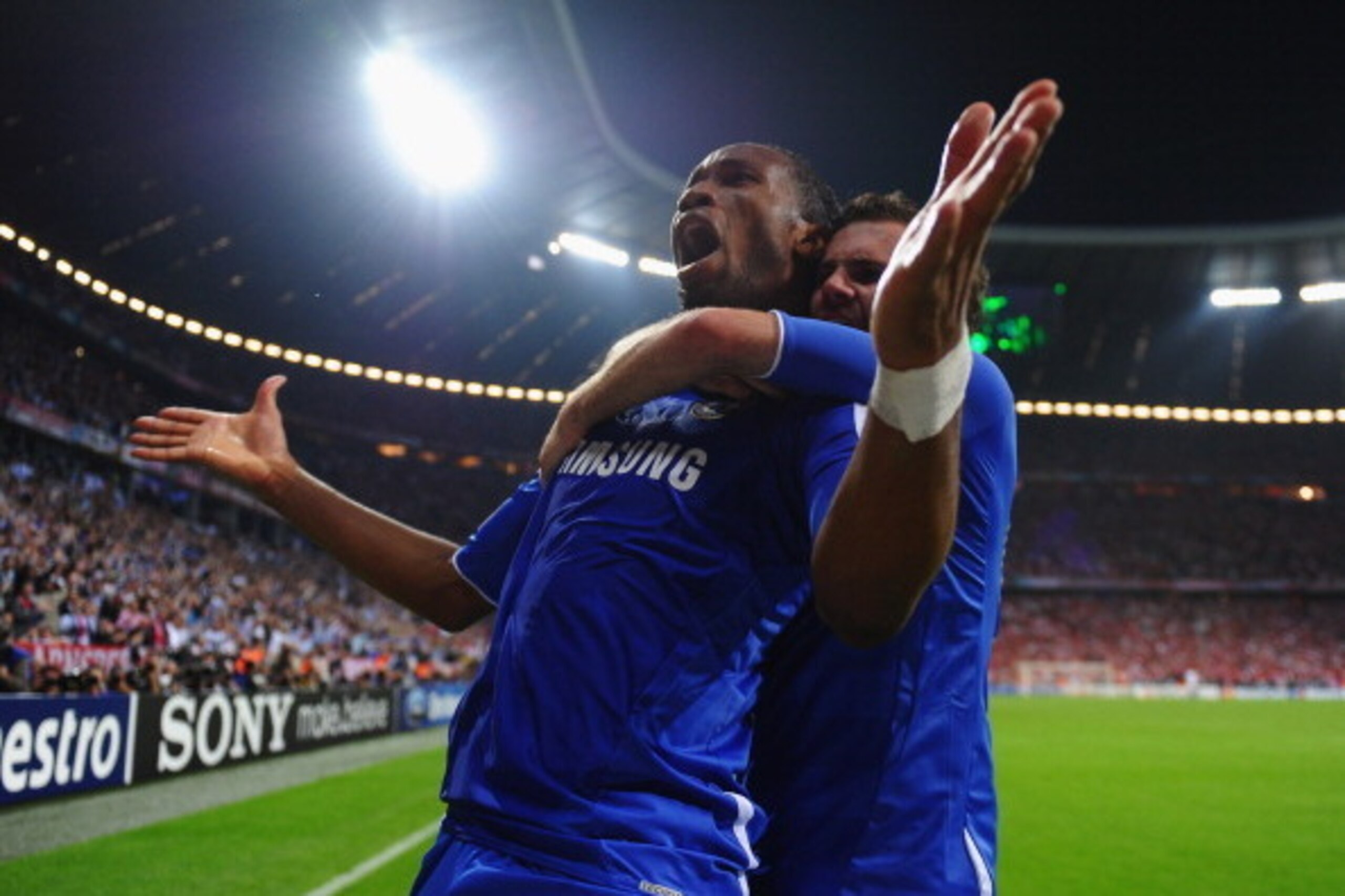 MUNICH, GERMANY - MAY 19: Didier Drogba of Chelsea celebrates with team mate Juan Mata after scoring his team’s first goal during UEFA Champions League Final between FC Bayern Muenchen and Chelsea at the Fussball Arena München on May 19, 2012 in Munich, MUNICH, GERMANY - MAY 19: Didier Drogba of Chelsea celebrates with team mate Juan Mata after scoring his team’s first goal during UEFA Champions League Final between FC Bayern Muenchen and Chelsea at the Fussball Arena München on May 19, 2012 in Munich,