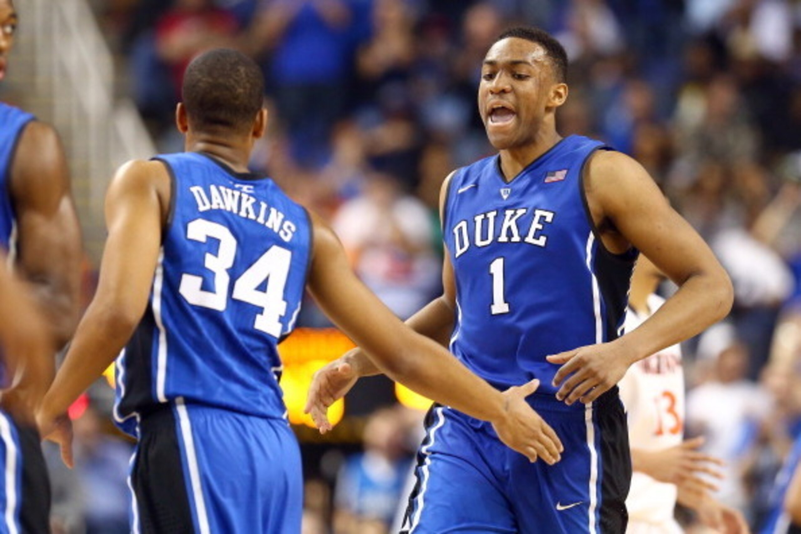 GREENSBORO, NC - MARCH 16:  Jabari Parker #1 of the Duke Blue Devils is congratulated by Andre Dawkins #34 of the Duke Blue Devils during their game against the Virginia Cavaliers in the finals of the 2014 Men's ACC Basketball Tournament at Greensboro Col