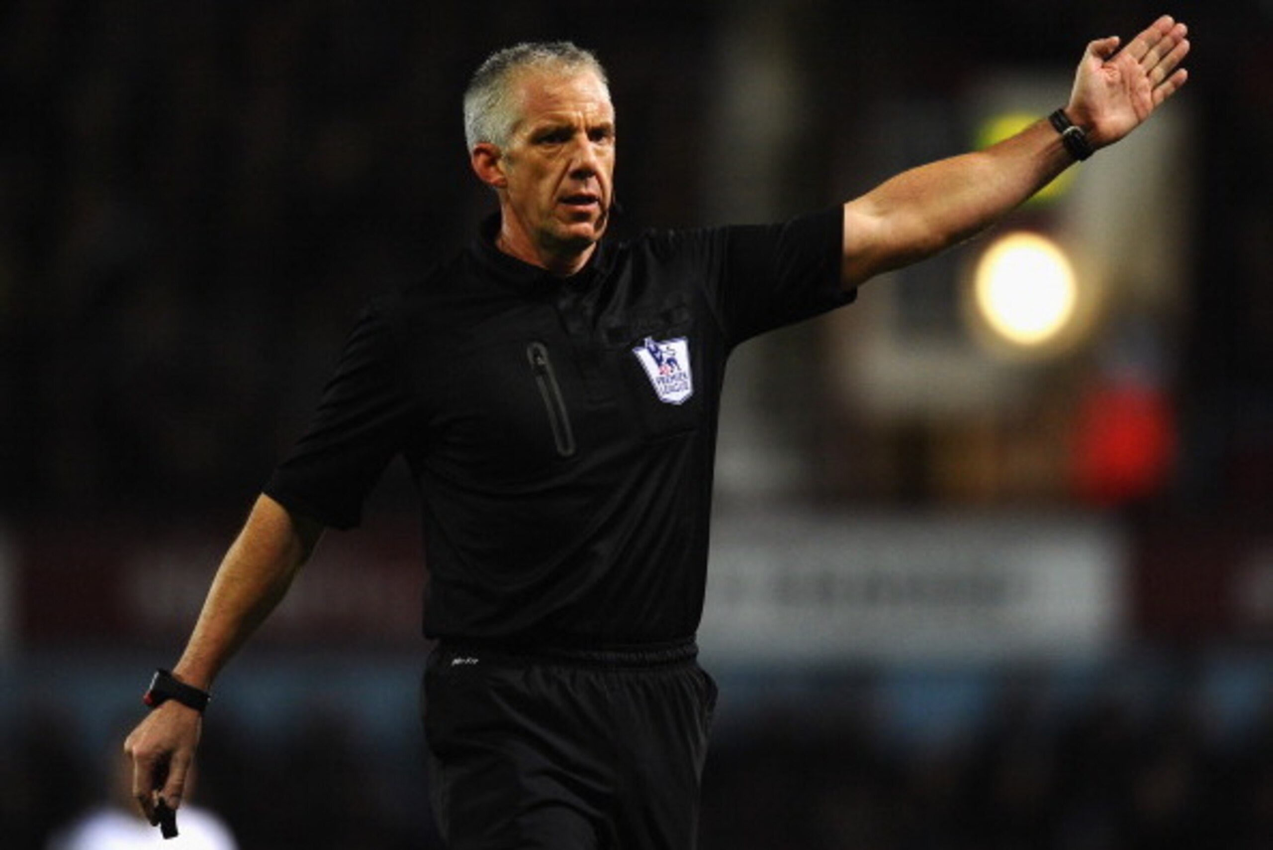 LONDON, ENGLAND - NOVEMBER 23:  Referee Chris Foy in action during the Barclays Premier League match between West Ham United and Chelsea at Boleyn Ground on November 23, 2013 in London, England.  (Photo by Mike Hewitt/Getty Images)