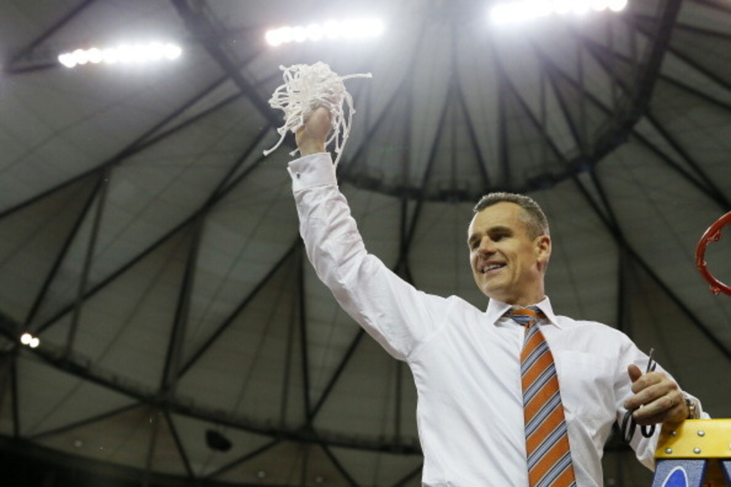 ATLANTA, GA - MARCH 16:  Head coach Billy Donovan of the Florida Gators celebrates by cutting down the net after their 61 to 60 win over the Kentucky Wildcats in the Championship game of the 2014 Men's SEC Basketball Tournament at Georgia Dome on March 16