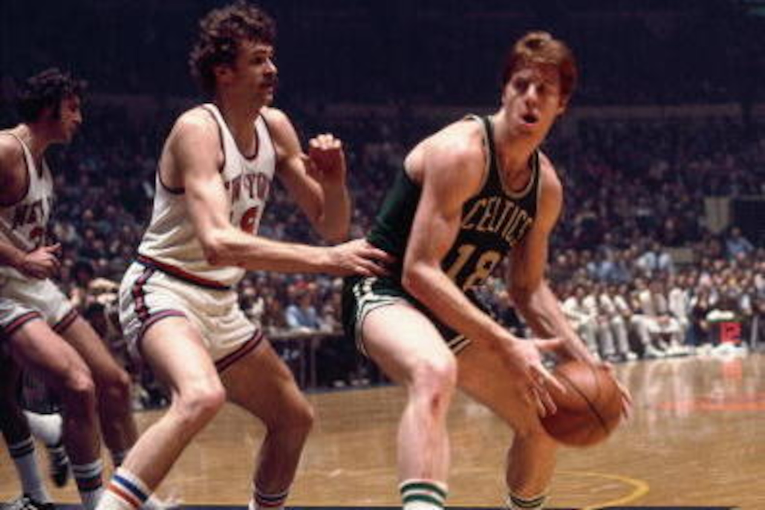 NEW YORK - 1973:  Dave Cowens #18 of the Boston Celtics looks to make a move against Phil Jackson #18 of the New York Knicks during the Eastern Conference Finals played in 1973 at Madison Square Garden in New York, New York. NOTE TO USER: User expressly a