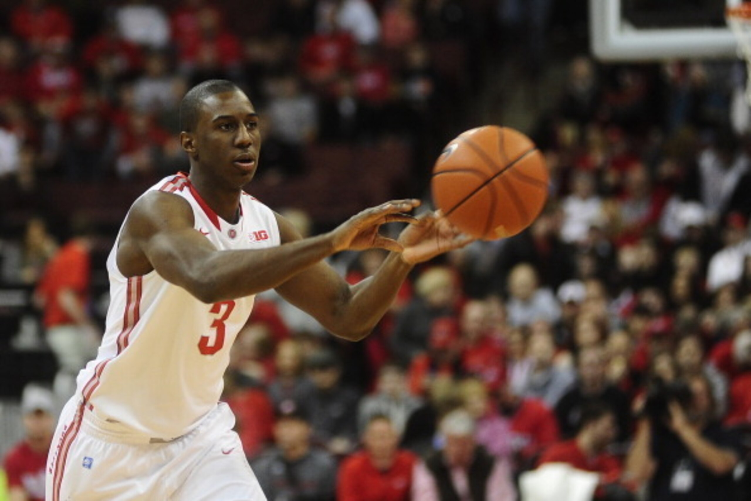 COLUMBUS, OH - JANUARY 4:  Shannon Scott #3 of the Ohio State Buckeyes passes the ball during the game against the Nebraska Cornhuskers on January 4, 20114 at Value City Arena in Columbus, Ohio.   (Photo by Ryan Young/Getty Images)