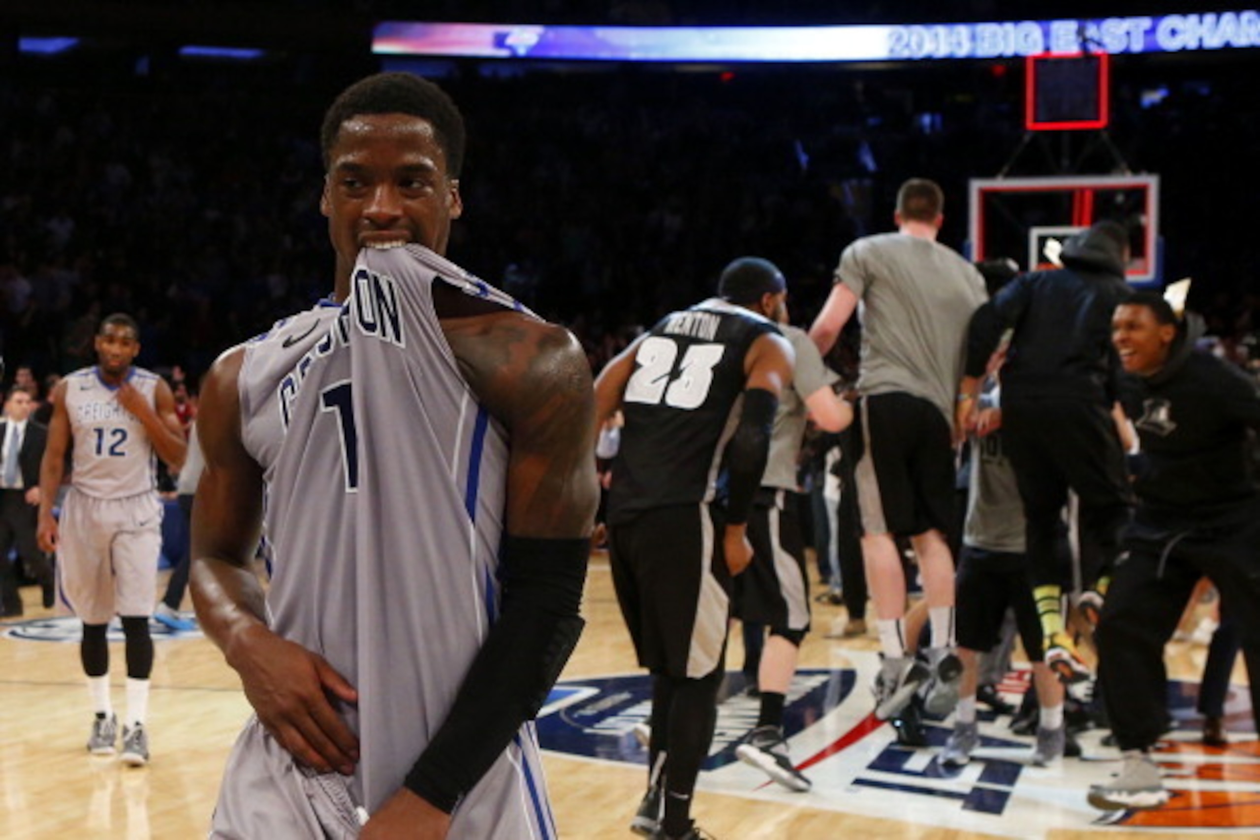 NEW YORK, NY - MARCH 15:  Austin Chatman #1 of the Creighton Bluejays walks off of the court dejected as the Providence Friars celebrate their 65 to 58 win in the Championship game of the 2014 Men's Big East Basketball Tournament at Madison Square Garden 