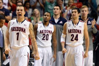 LAS VEGAS, NV - MARCH 15:  Gabe York #1 of the Arizona Wildcats reacts as teammates Jordin Mayes #20 and Elliott Pitts #24 look on during a timeout in the championship game of the Pac-12 Basketball Tournament against the UCLA Bruins at the MGM Grand Garde