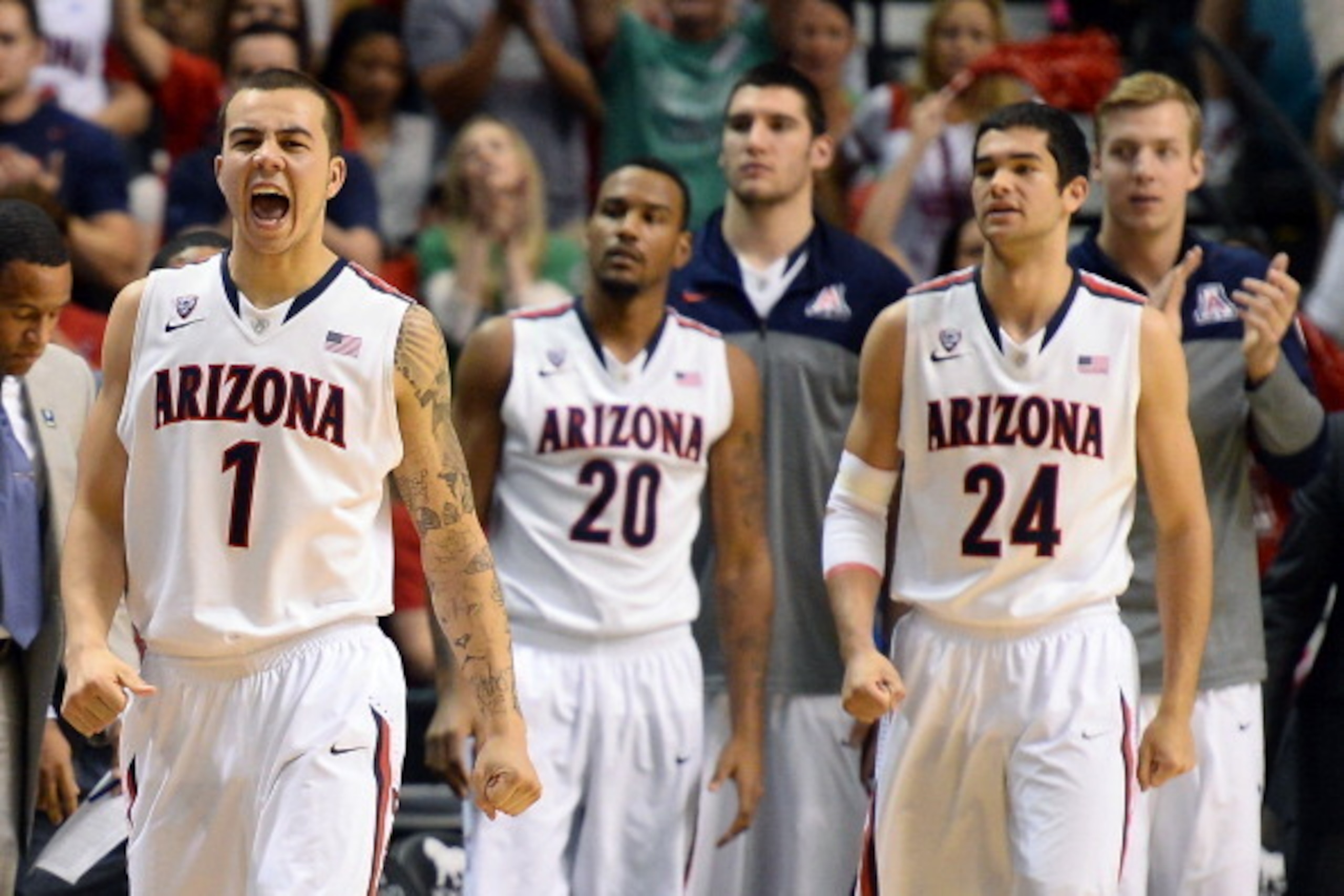 LAS VEGAS, NV - MARCH 15:  Gabe York #1 of the Arizona Wildcats reacts as teammates Jordin Mayes #20 and Elliott Pitts #24 look on during a timeout in the championship game of the Pac-12 Basketball Tournament against the UCLA Bruins at the MGM Grand Garde