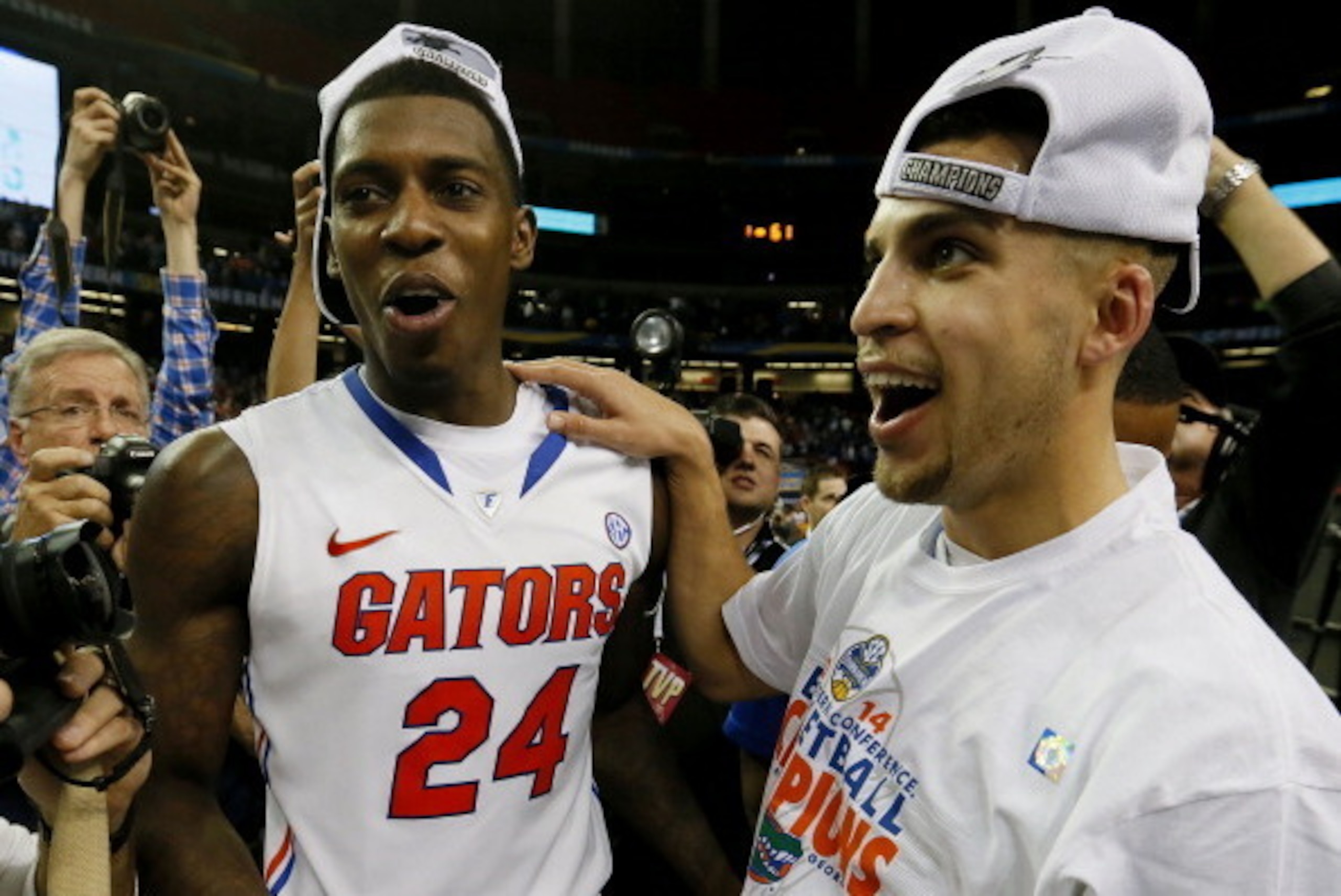 ATLANTA, GA - MARCH 16:  Scottie Wilbekin #5 and Casey Prather #24 of the Florida Gators celebrate their 61 to 60 win over the Kentucky Wildcats in the Championship game of the 2014 Men's SEC Basketball Tournament at Georgia Dome on March 16, 2014 in Atla