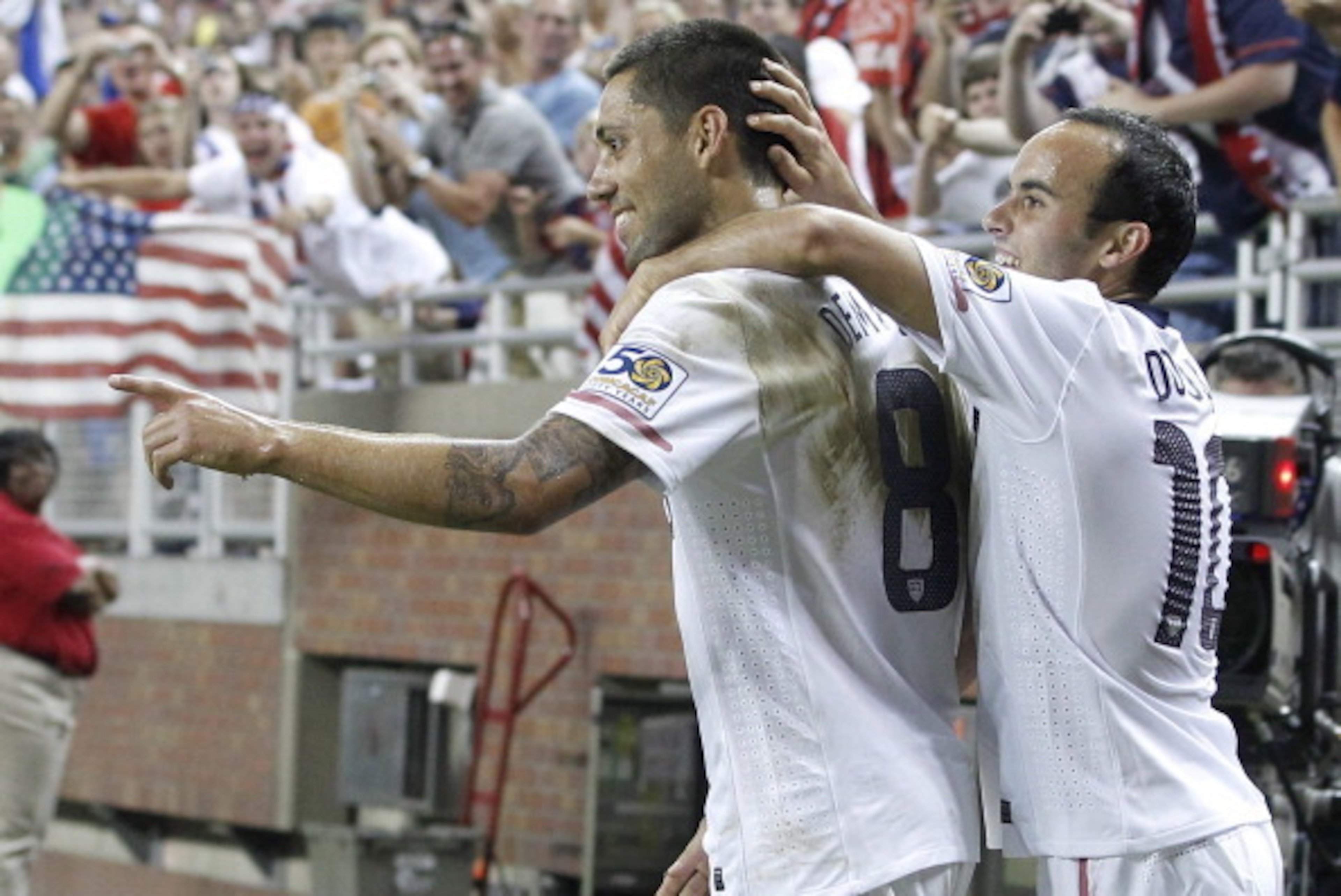 DETROIT, MI - JUNE 7: Clint Dempsey #8 of the United States celebrates a second half goal with Landon Donovan #10 while playing Canada during the 2011 Gold Cup  at Ford Field on June 7, 2011 in Detroit, Michigan. The United States won the game 2-0. (Photo