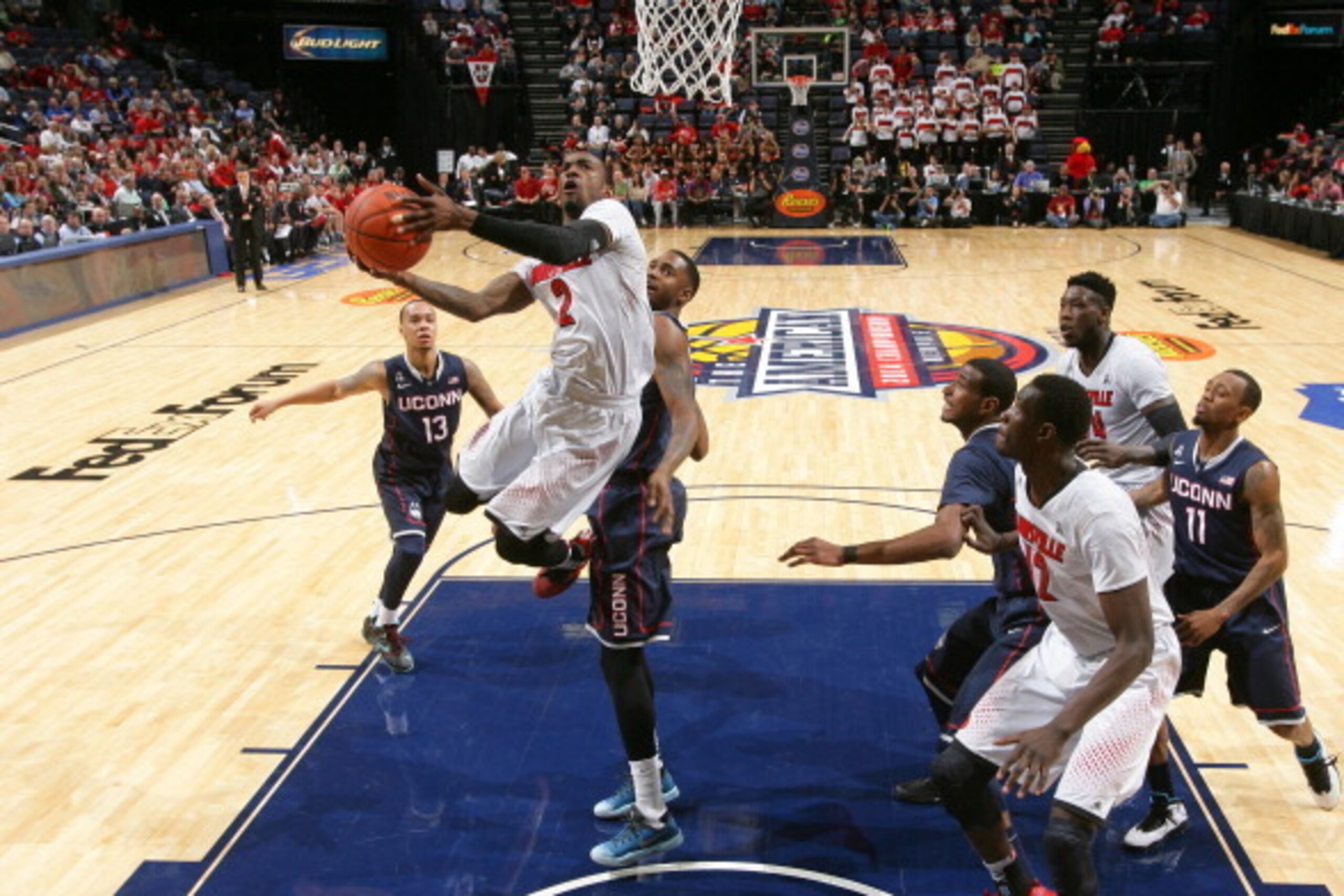 MEMPHIS, TN - MARCH 15: Russ Smith #2 of the Louisville Cardinals drives to the basket for a layup against the Connecticut Huskies during the Championship of the American Athletic Conference Tournament at FedExForum on March 15, 2014 in Memphis, Tennessee
