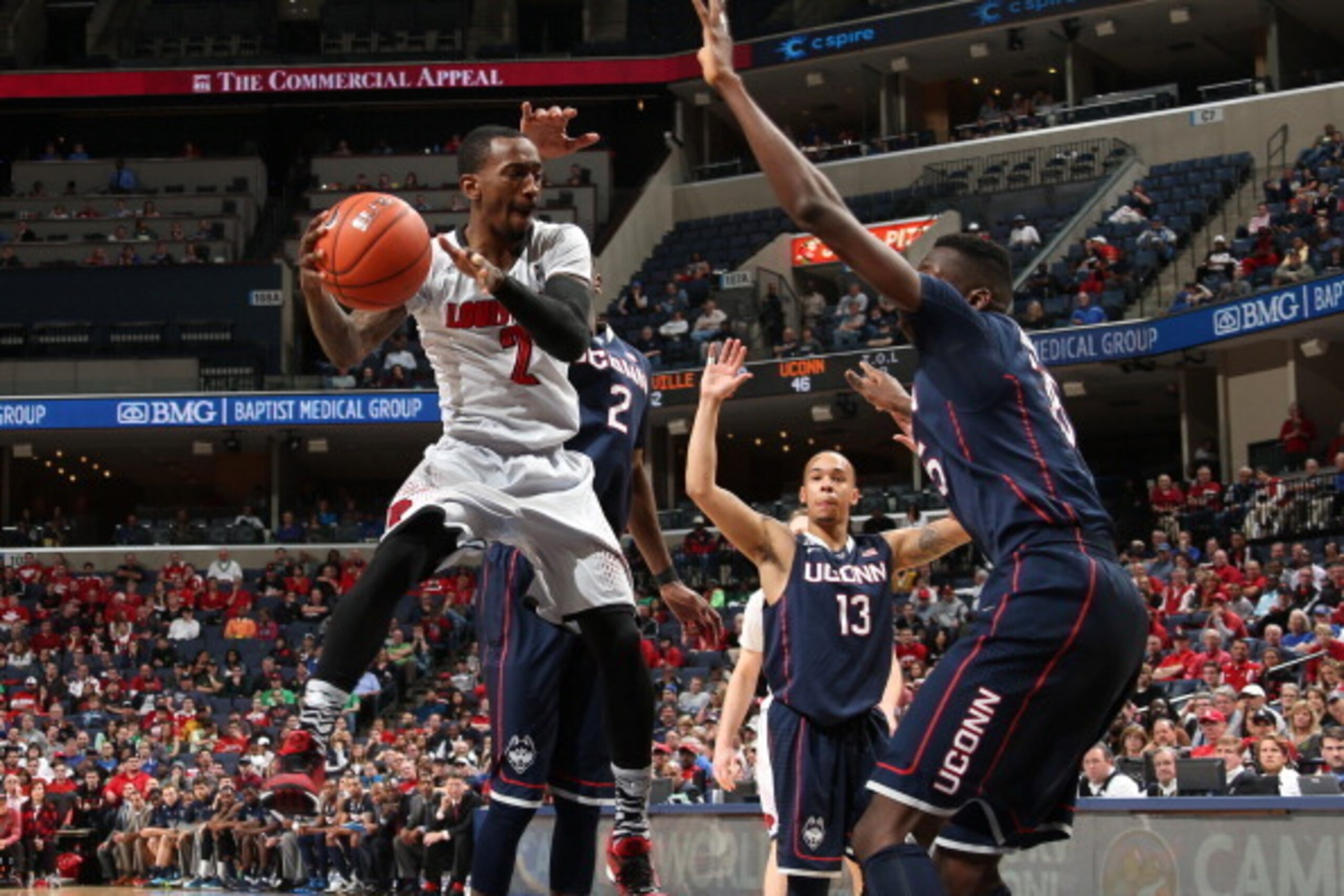 MEMPHIS, TN - MARCH 15: Russ Smith #2 of the Louisville Cardinals drives to the basket against Amida Brimah #35 of the Connecticut Huskies during the Championship of the American Athletic Conference Tournament at FedExForum on March 15, 2014 in Memphis, T MEMPHIS, TN - MARCH 15: Russ Smith #2 of the Louisville Cardinals drives to the basket against Amida Brimah #35 of the Connecticut Huskies during the Championship of the American Athletic Conference Tournament at FedExForum on March 15, 2014 in Memphis, T