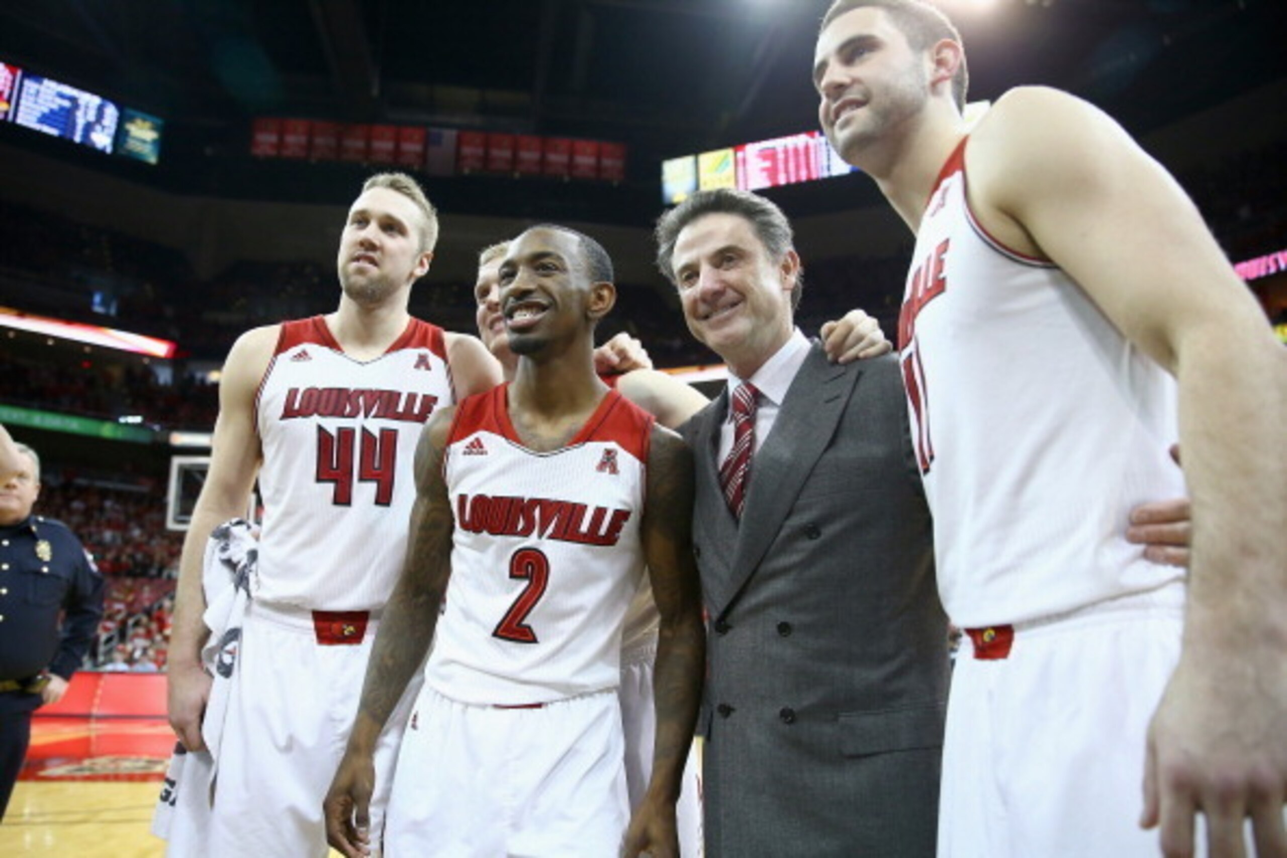 LOUISVILLE, KY - MARCH 08:  Stephan Van Treese #44 , Tim Henderson #15, Russ Smith #2, Rick Pitino and Luke Hancock #11 of the Louisville Cardinals after the game against the Connecticut Huskies at KFC YUM! Center on March 8, 2014 in Louisville, Kentucky.